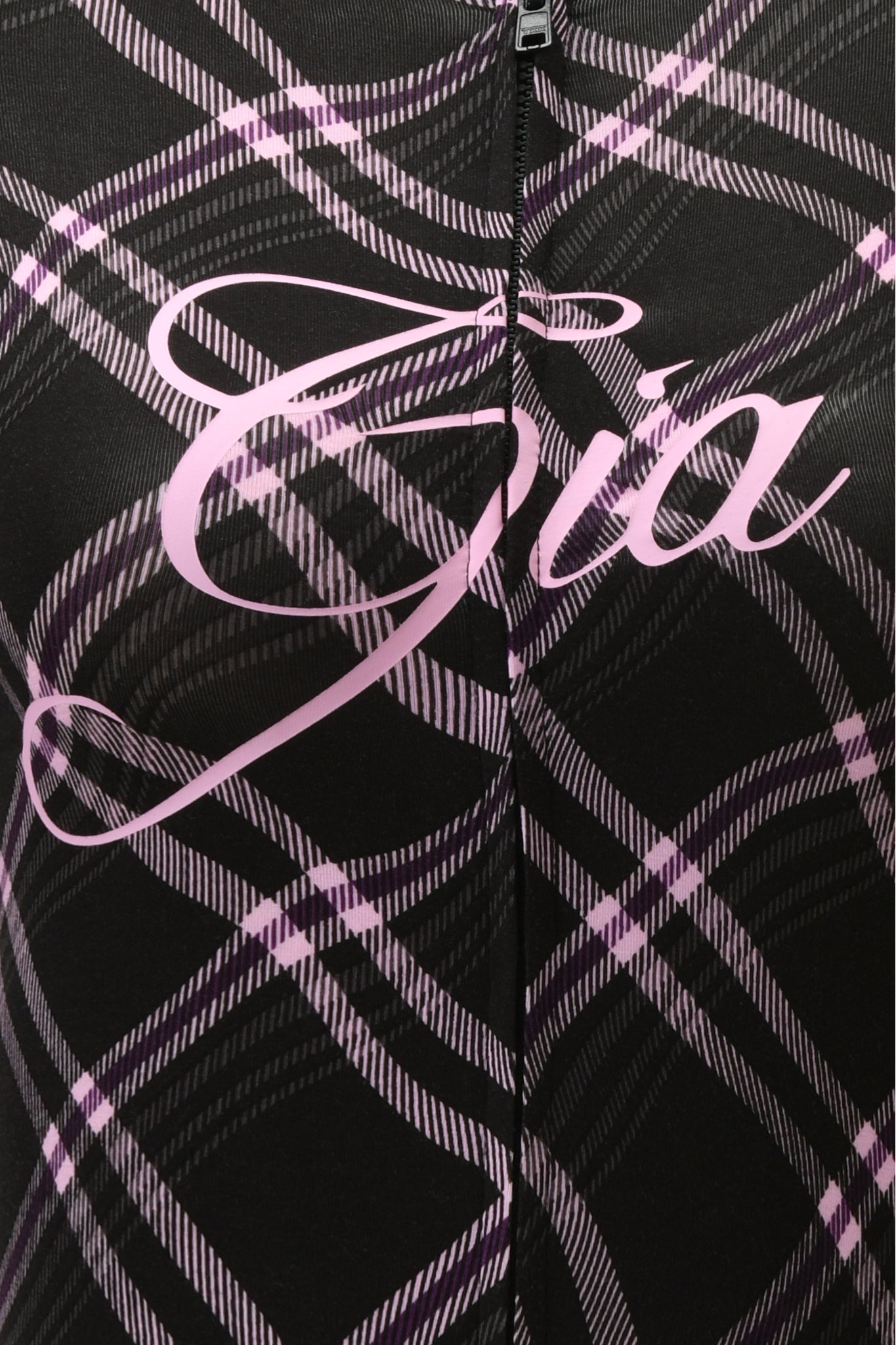 Close-up of the BLARE HOODIE - BLACK WARPED PLAID by I.AM.GIA, showing black fabric with a pink and white plaid pattern and "Gia" in large cursive pink letters across this stylish women's hoodie.