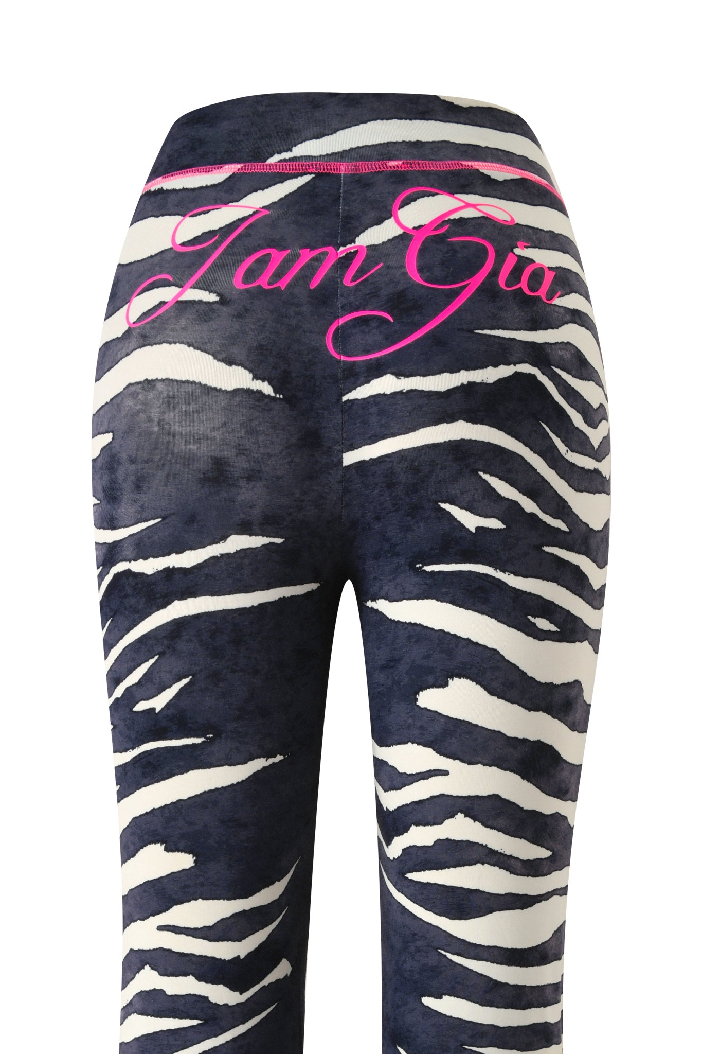 BLARE TRACKPANT - BLACK WILD SIDE by I.AM.GIA, featuring a bold zebra print and “I am Gia” in pink cursive lettering on the waistband, showcased from the back for a fierce update to the brand’s classic trackpant style.