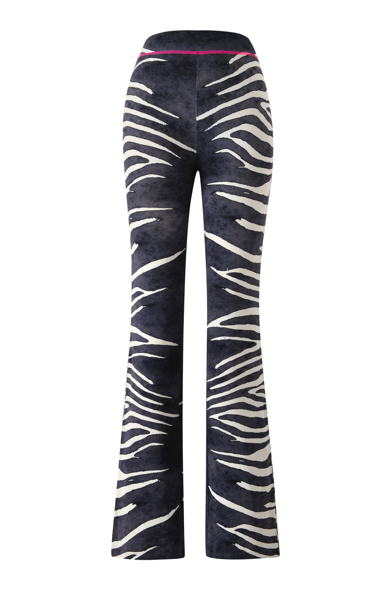 The BLARE TRACKPANT - BLACK WILD SIDE by I.AM.GIA is a high-waisted, flared trackpant showcasing a black and white zebra print with a slim pink waistband accent, displayed from the back on a white background.