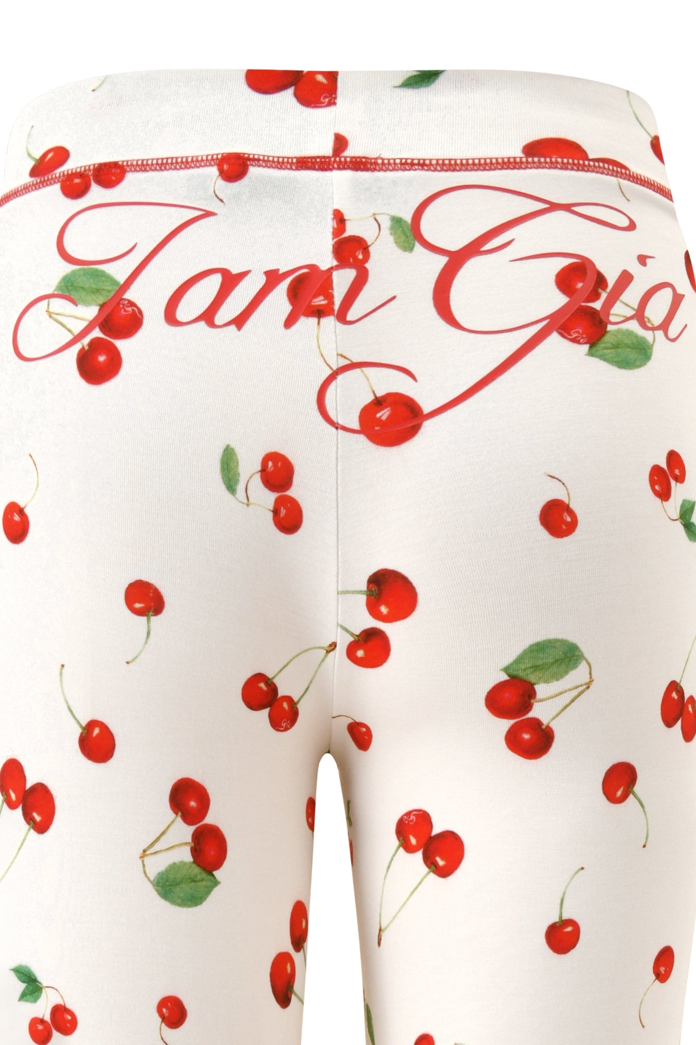 Close-up of I.AM.GIA’s BLARE TRACKPANT - CHERRY ON TOP in soft bamboo, featuring the Cherry on Top print and partial red "Jam Gia" cursive text near the waistband.