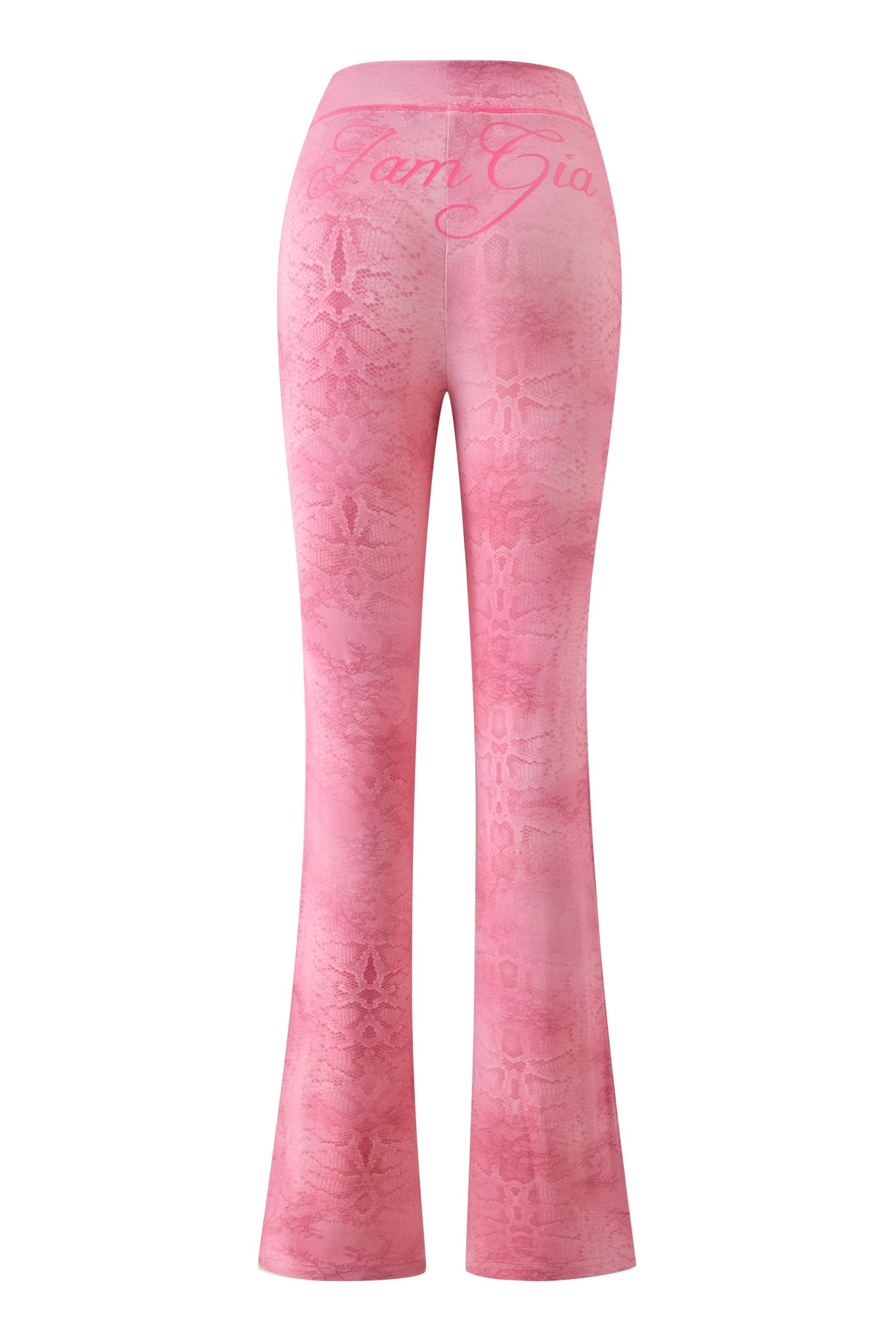 The BLARE TRACKPANT - LIGHT PINK SERPENTINE by I.AM.GIA features a flared leg, subtle lace pattern, and “I.AM.GIA” in cursive on the back waistband. The fabric hugs hips and thighs before flaring out below the knees.