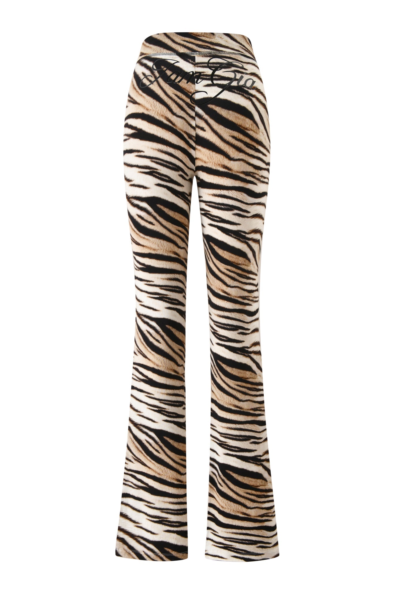 The I.AM.GIA BLARE TRACKPANT - LIGHT TIGRESS is a high-waisted, flared pant with a black, brown, and white tiger stripe pattern and bold black cursive lettering on the waistband.