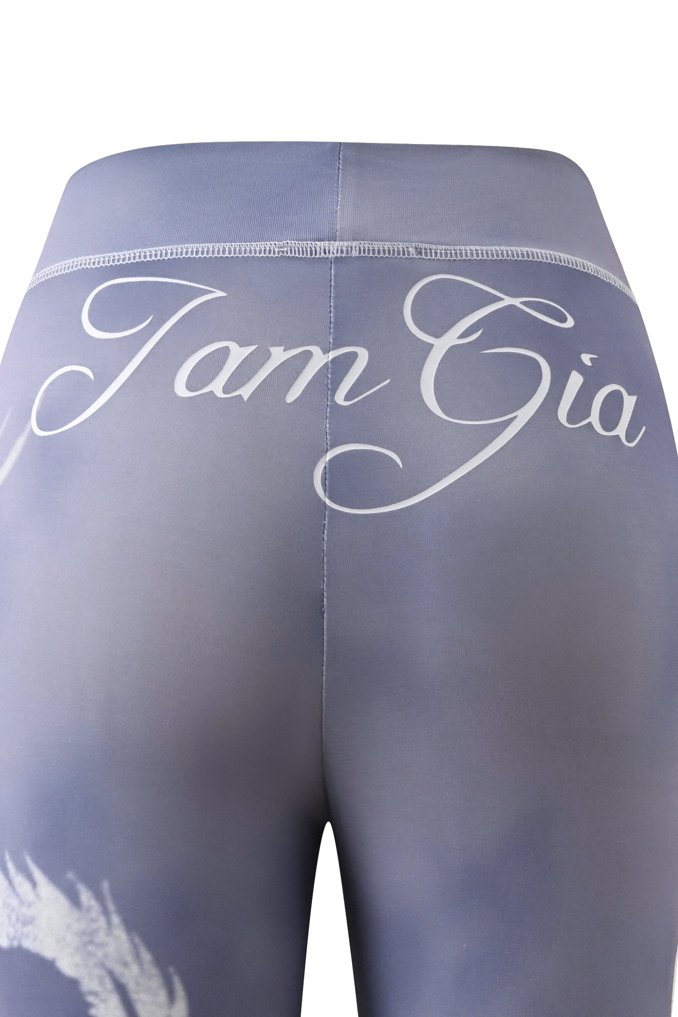Close-up of the back of steel blue leggings with the words “I.AM.GIA” in white cursive script across the waistband, styled similarly to popular I.AM.GIA designs like the BLARE TRACKPANT - STEEL BLUE DRAGON.