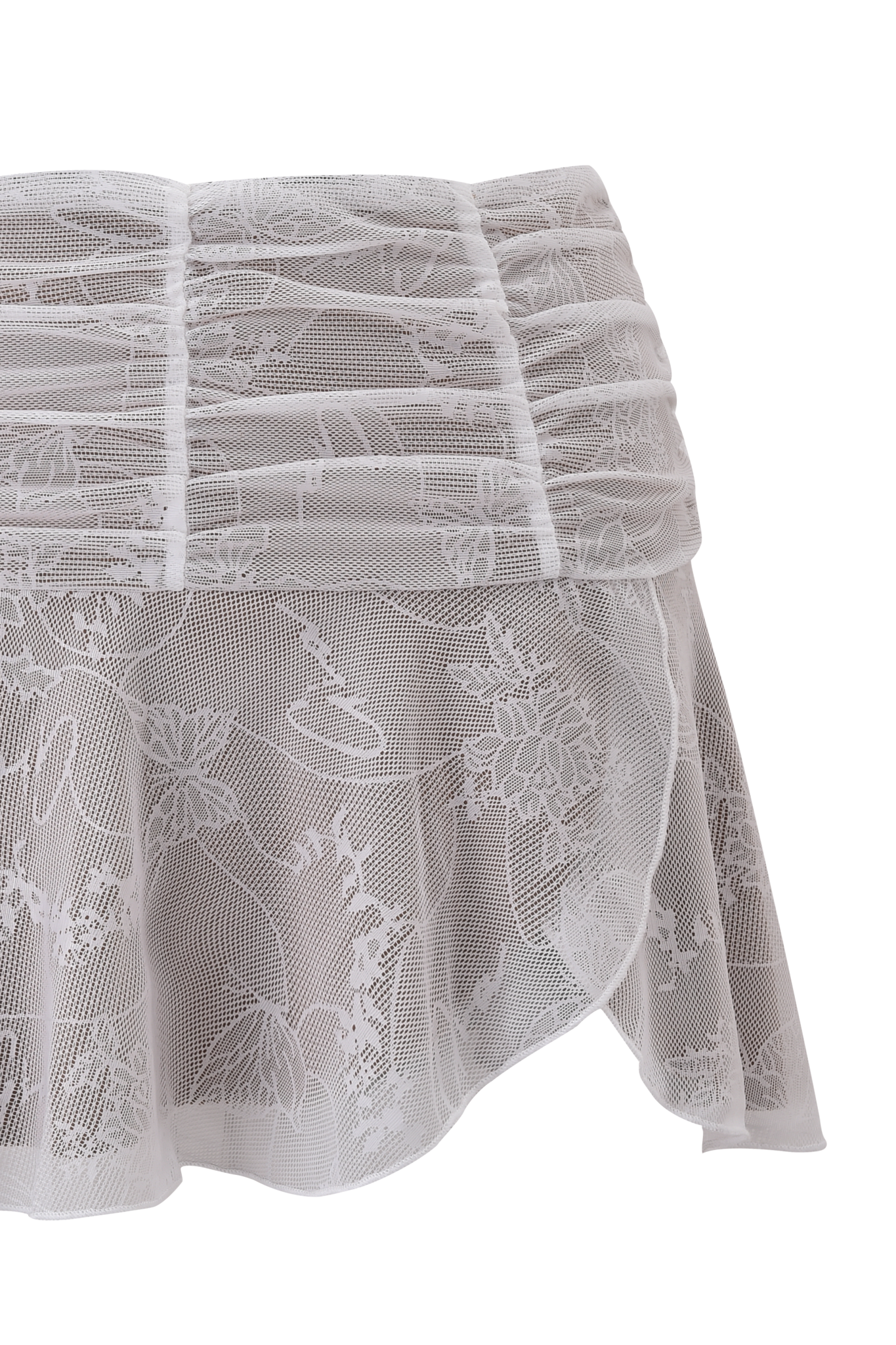 The YVETTE SKIRT - WHITE : BUTTERFLY LACE by I.AM.GIA is a white mini skirt with floral butterfly lace, layered horizontal pleats at the top, and a sheer flowing hem.