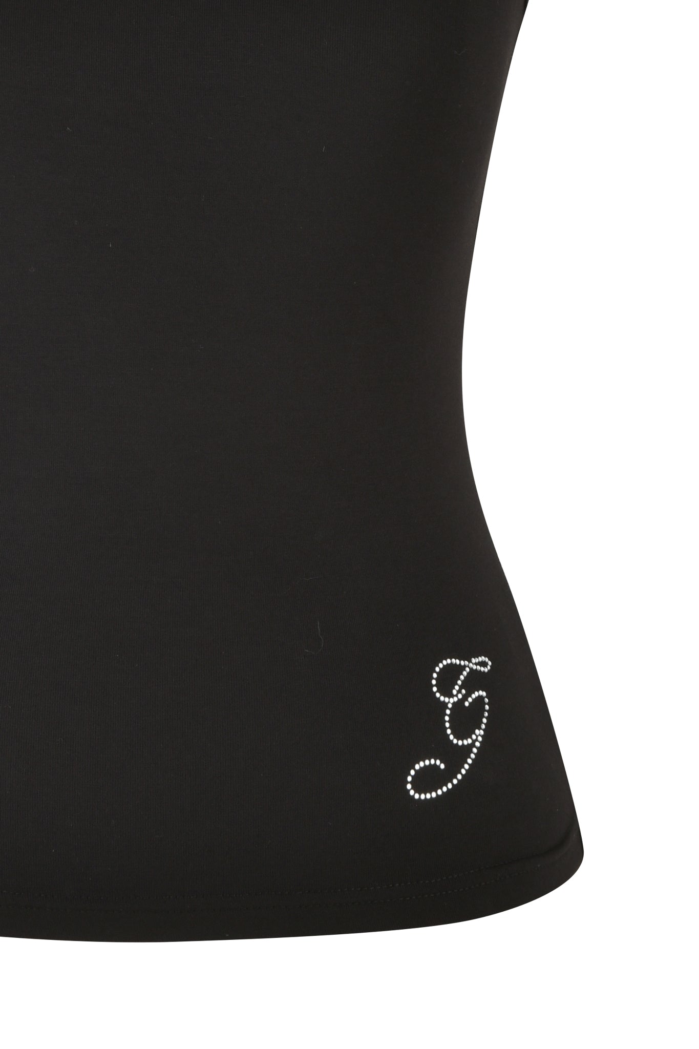 A detailed view of the ERIN TOP - BLACK from I.AM.GIA reveals a stylized letter "G" crafted in tiny rhinestones near the hem. The garment's smooth texture hints at its bamboo fabrication, offering an eco-friendly element to its sophisticated design.
