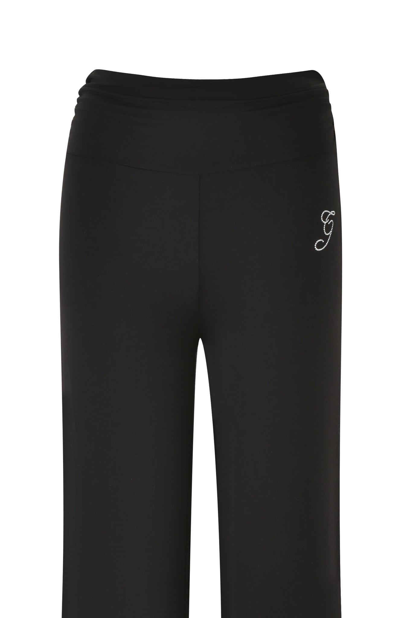 The ERIN PANT - BLACK by I.AM.GIA features high-waisted, wide-leg black pants with a distinctive white "G" embroidered on the upper left side. Made from fabric enriched with bamboo, these pants are smooth and stretchy.
