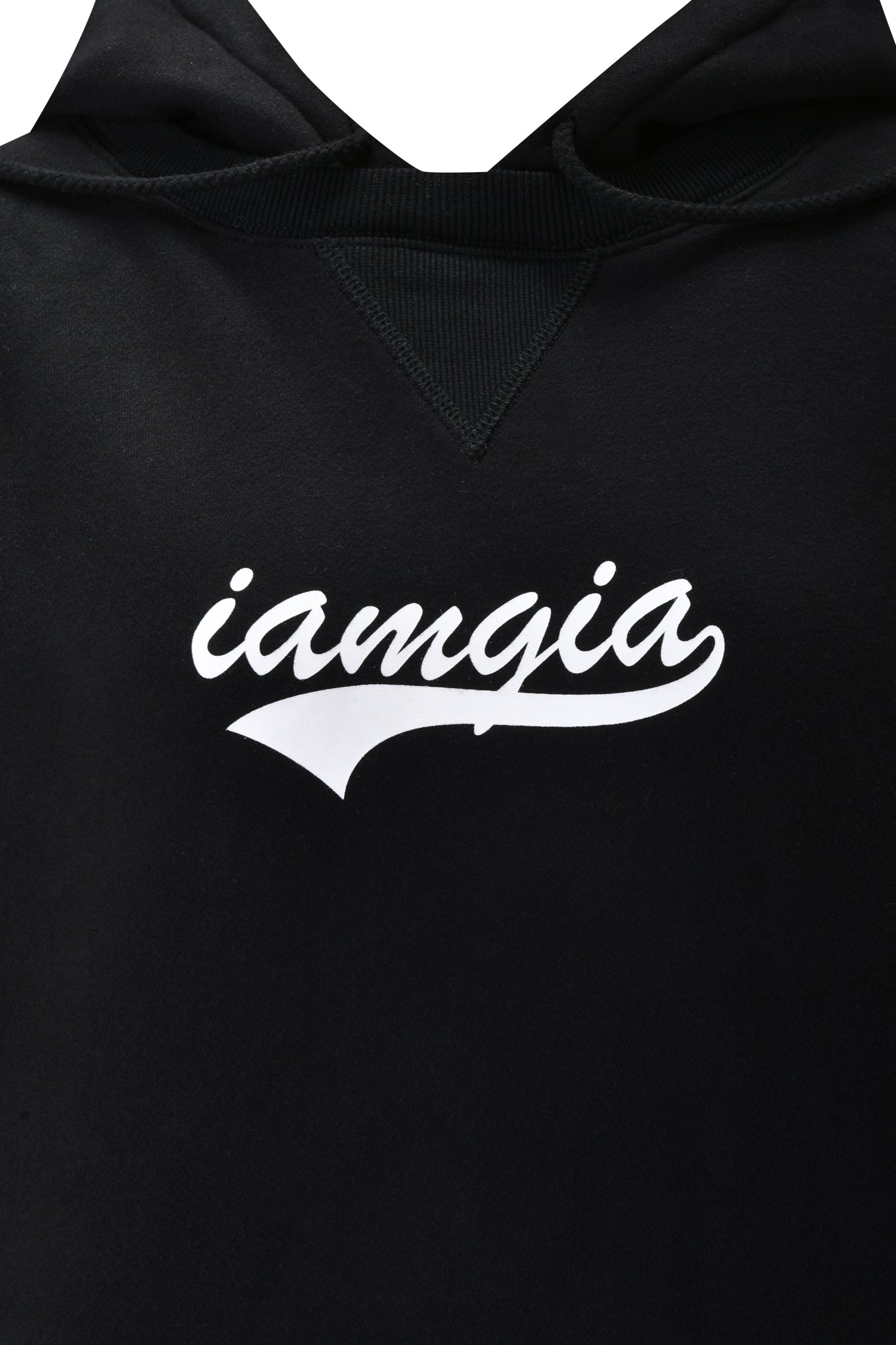 Close-up of the DORIAN HOODIE in black by I.AM.GIA, showcasing its oversized fit and white, stylized I.AM.GIA logo with a swoosh underline across the chest.