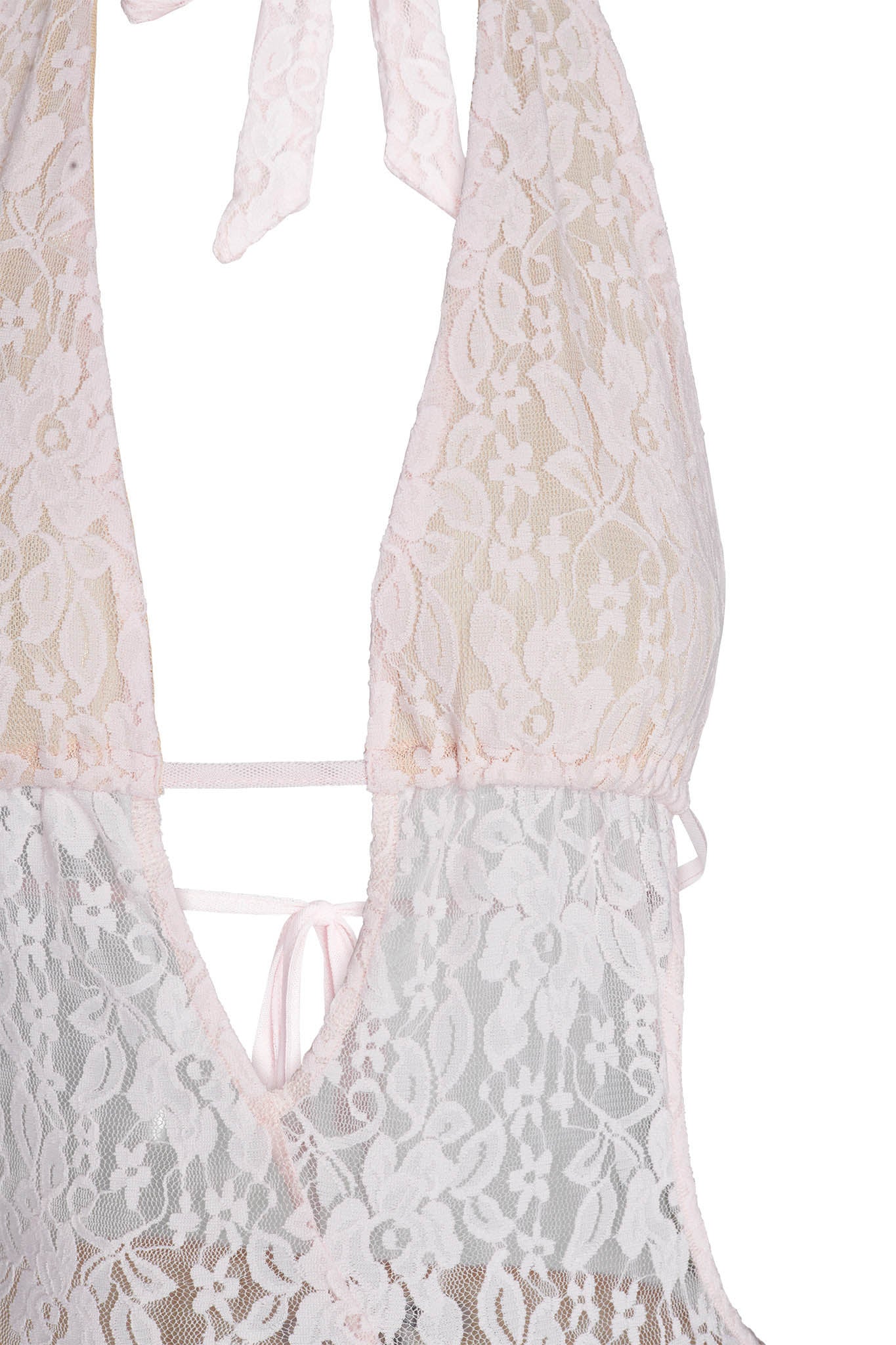 Close-up of the IRISIA LACE DRESS in pink by I.AM.GIA, showcasing its delicate baby pink lace with a floral pattern. The semi-transparent fabric complements the backless mini dress, featuring an elegant halter neck with a tie at the back.