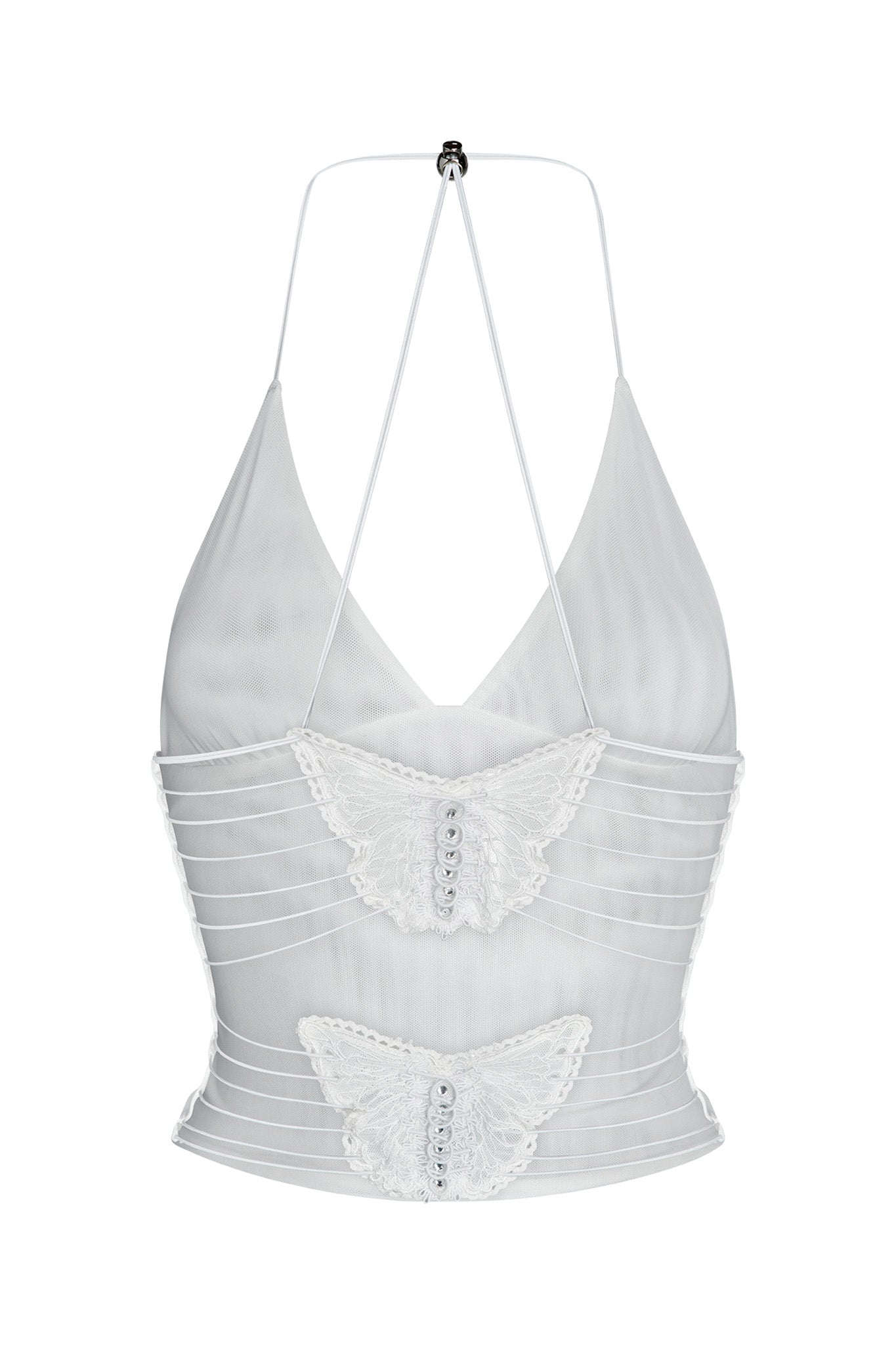 The ELLERY TOP - WHITE by I.AM.GIA is a semi-sheer crop top with a halter neck design featuring thin straps. It is adorned with two lace butterfly appliques, each detailed with small buttons down the center. The fabric has a horizontally ribbed texture, enhancing its delicate appearance.