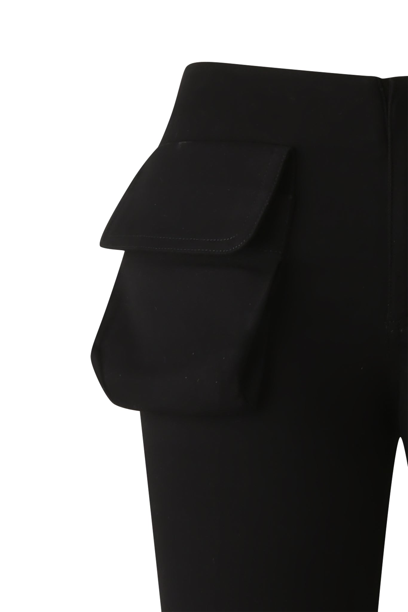 Close-up of the KIMANI PANT - BLACK by I.AM.GIA, showcasing a large rectangular flap pocket on the left hip. These mid-rise black cargo pants are set against a white background.
