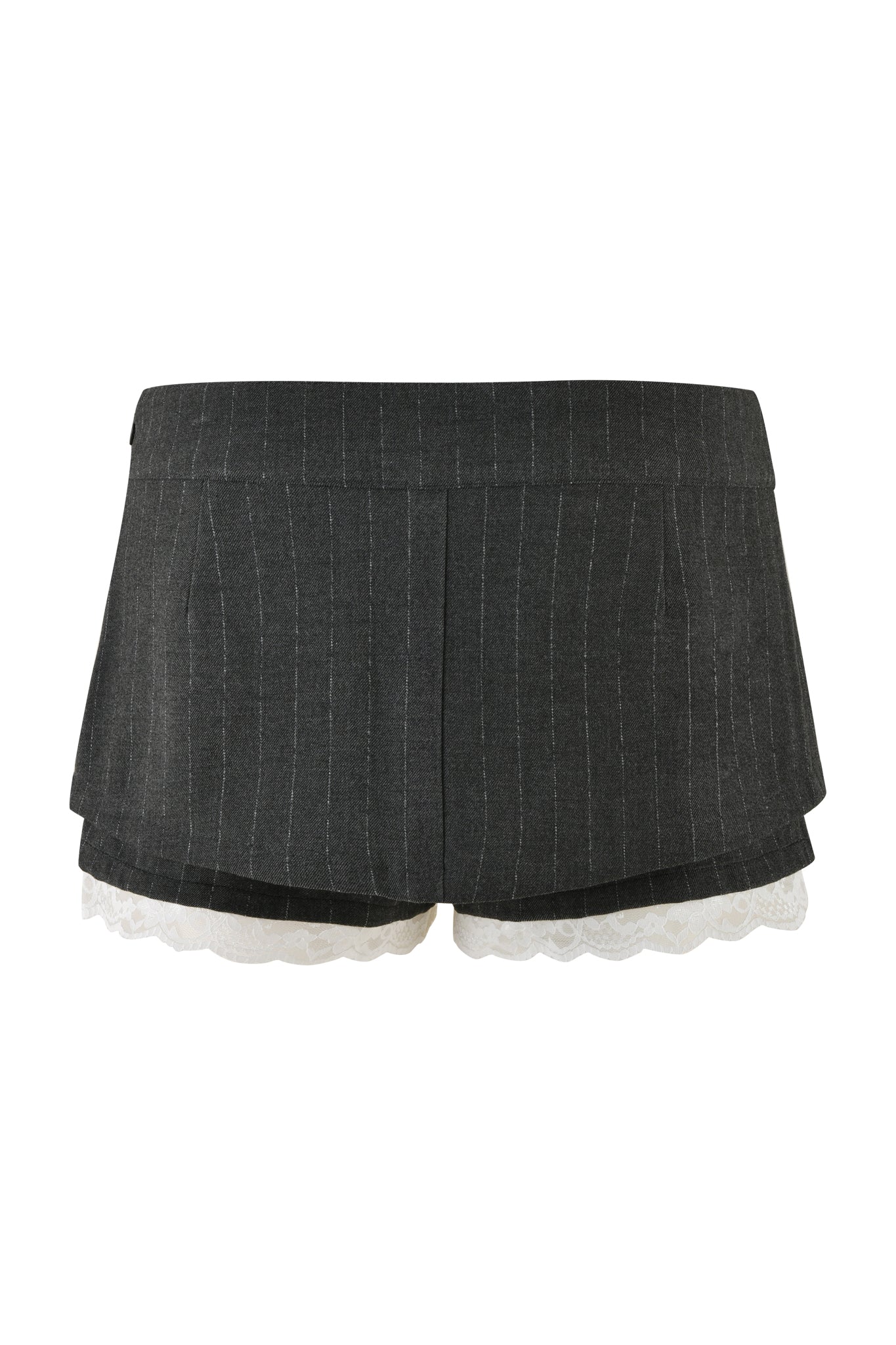 The MARRION SKORT - GREY : PINSTRIPE by I.AM.GIA is a high-waisted, dark gray pinstriped micro mini skort with white lace trim peeking out from the bottom hem. It features built-in shorts, offering a tailored, structured design along with two front pockets for added functionality.