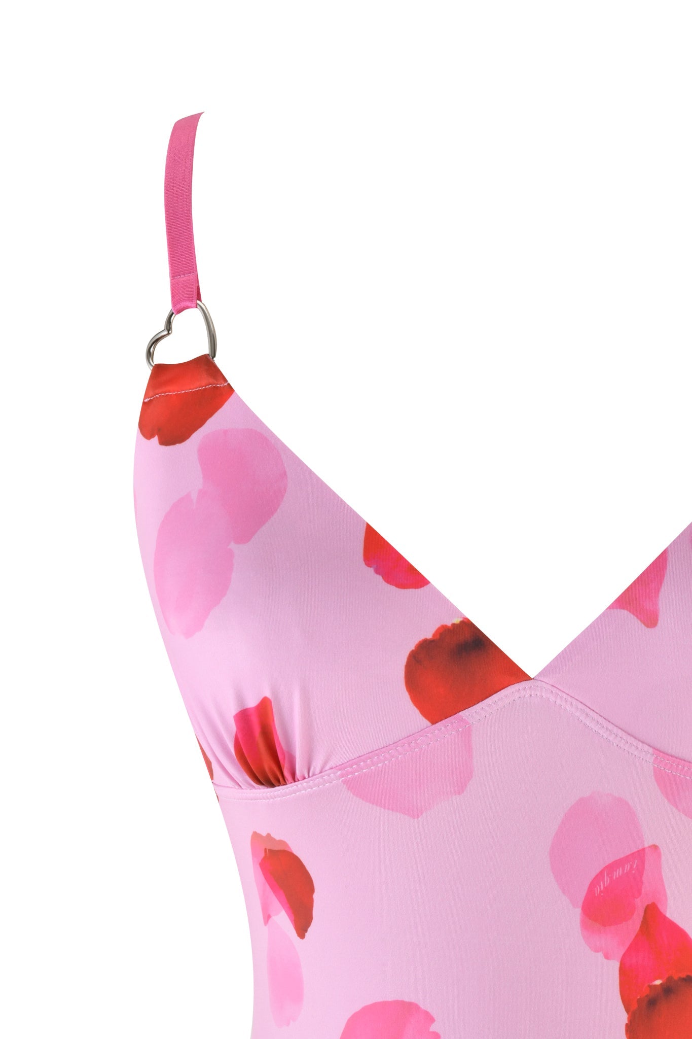 Close-up of a pink floral-patterned I.AM.GIA ODETTA TOP - PINK : PRETTY PETAL, featuring thin straps and a V-neck. The fabric has a rose petal print in red and pink. The background is plain white.