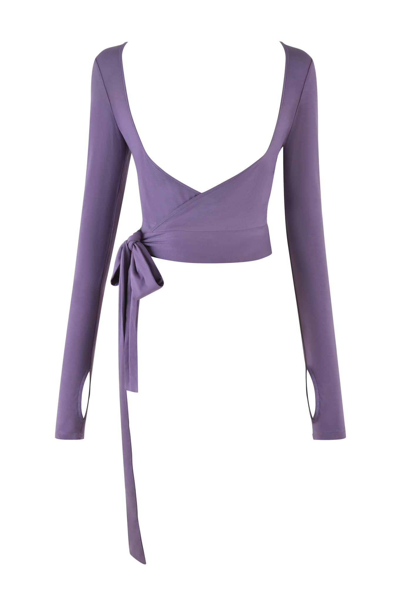 The STELLA TOP - PURPLE: DUSTY LILAC by I.AM.GIA is a long-sleeved wrap top with a deep V-neckline and a side tie closure that forms a knot with a trailing ribbon. Crafted from soft jersey fabric, it features elongated sleeves with small wrist cutouts for a smooth texture.