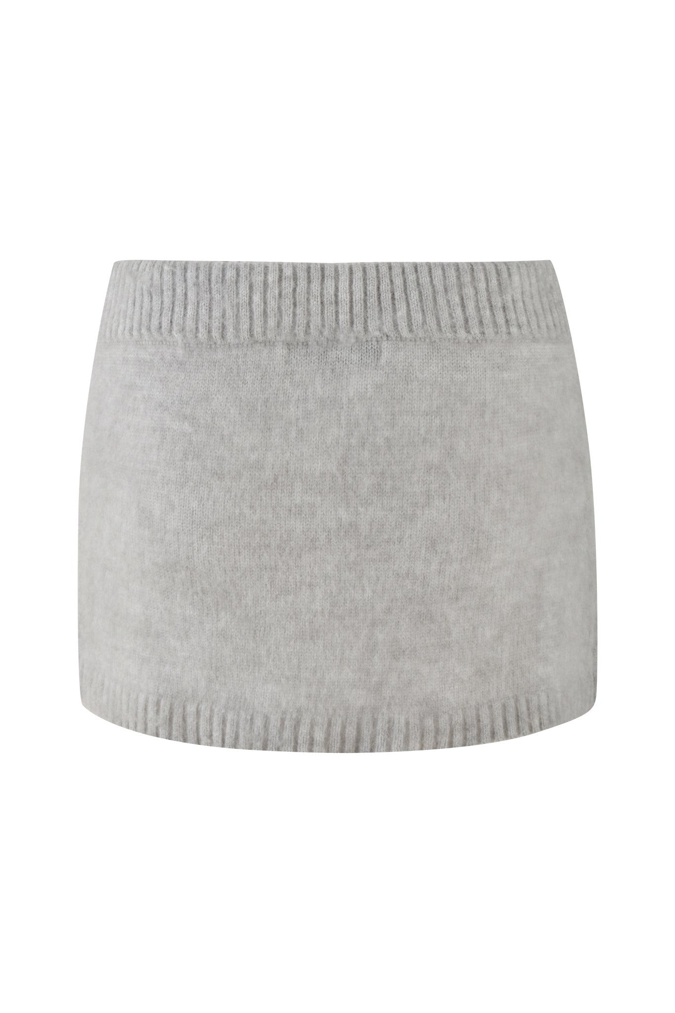 The BEATRIZ MINI SKIRT - GREY : MARLE by I.AM.GIA is displayed on a white background, highlighting its light gray knit fabric with ribbed waistband and hem. The material looks soft and stretchy, subtly reflecting the texture of knit grey marle.