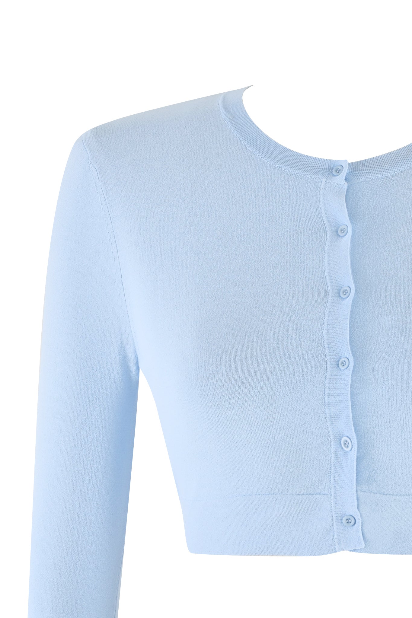 The image showcases the AUDRINA CARDIGAN by I.AM.GIA in Powder Blue. This long-sleeve, cropped cardigan features a crew neckline and a button-up front. The true knit fabrication appears soft and lightweight, perfectly complementing its bodycon fit.