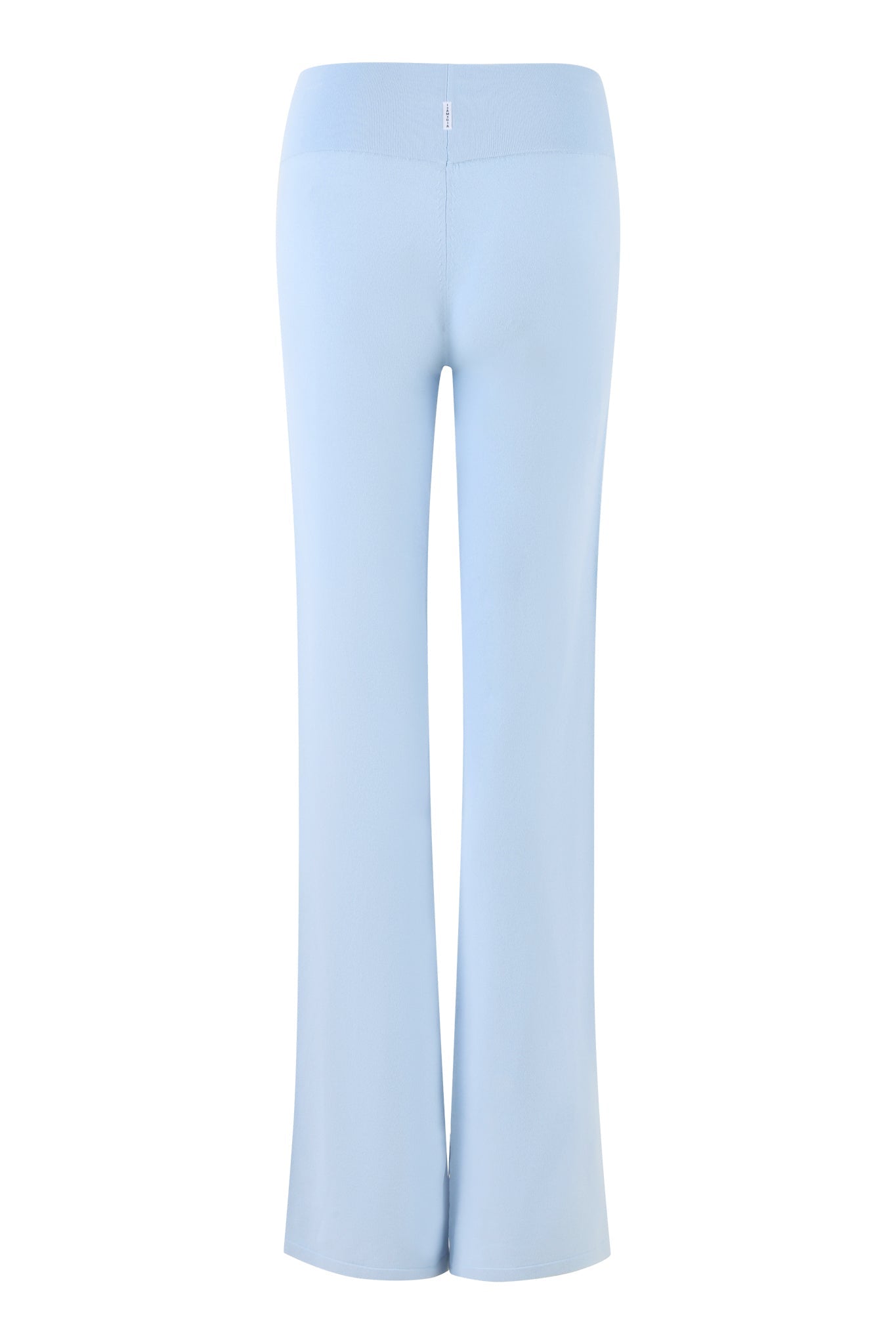 A pair of high-stretch, powder blue, high-waisted, wide-leg Audrina Pants from I.AM.GIA viewed from the back. The pants are made of a soft, flowy fabric and feature a seamless appearance with no visible pockets or embellishments.