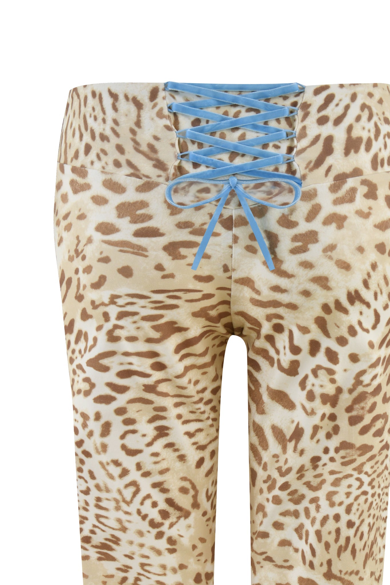 The GERI CAPRI from I.AM.GIA, named NEUTRAL : LEOPARD : LEOPARD LIMBO, showcases a playful twist with its vibrant leopard print in various shades of brown and beige. These low-rise capri leggings feature a distinctive blue lace-up detail at the waistband and are shown from the back.