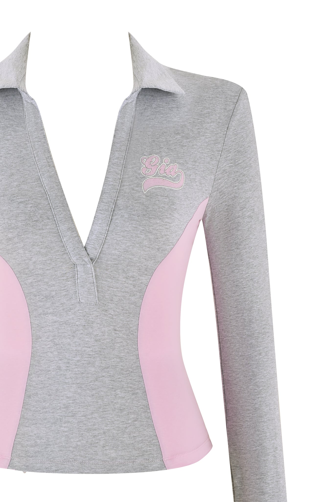 The JENNIFER TOP by I.AM.GIA is a long-sleeved, fitted top featuring a deep V-neck and bodycon silhouette. It is primarily gray with pink side panels and showcases embroidered script on the chest.