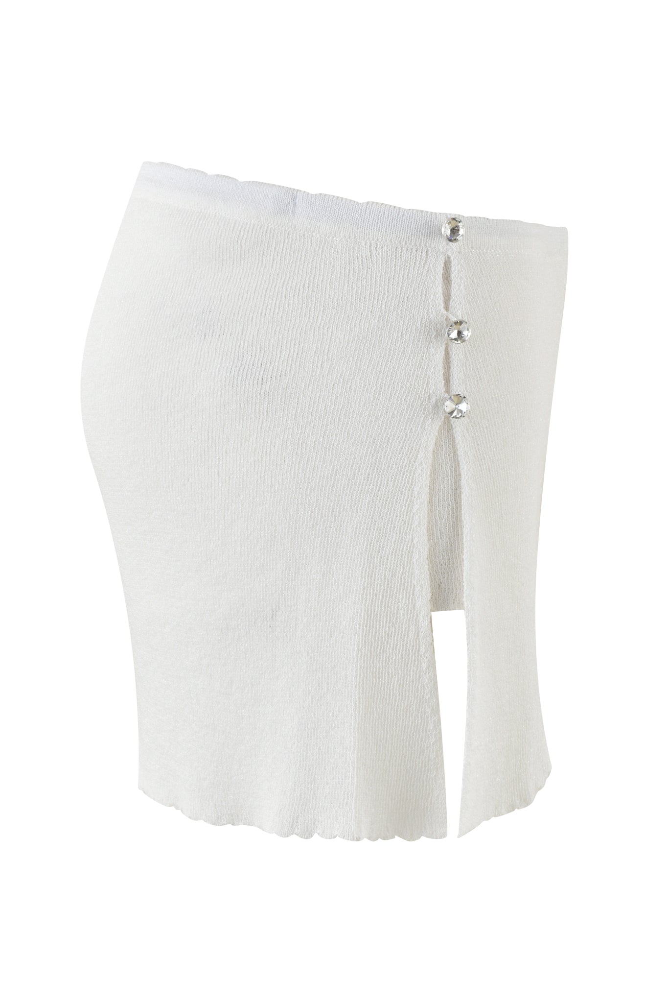 The BLISS SKORT - WHITE : SNOW WHITE by I.AM.GIA is a sophisticated knee-length knit skirt crafted from textured fabric with a high waist and shimmery lurex yarn. It features a front slit accented by three decorative buttons on the side, enhancing its elegant design, while the hem possesses a slightly scalloped finish.