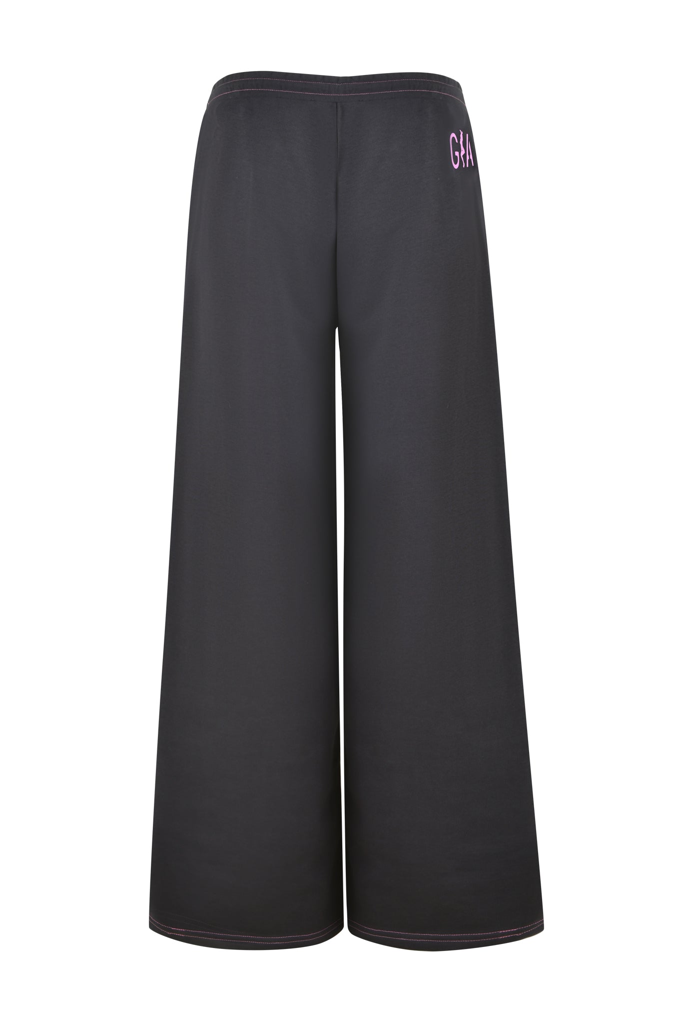 The SPENCER PANT in charcoal grey by I.AM.GIA features wide legs and a high waistband, with "GA" adorned in small purple text on the back upper right side. These trousers are distinguished by hot pink contrast stitching and are showcased against a plain white background.