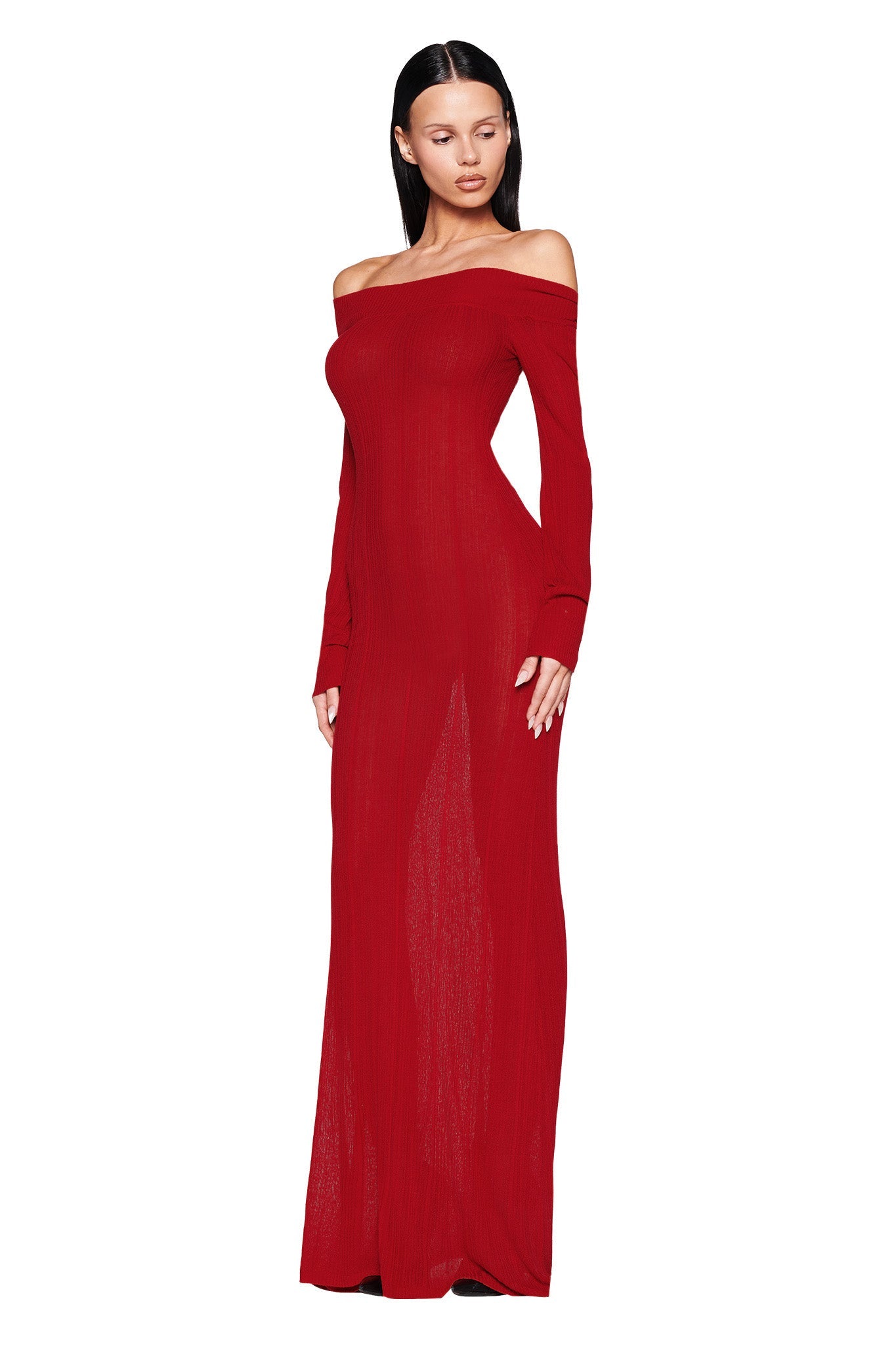 A person wearing the striking Anastasia Maxi Dress in burgundy by I.AM.GIA poses gracefully against a white background. The dress features an elegant off-the-shoulder design with long sleeves and a sleek knit fabrication, while the person's straight, dark hair worn down enhances the understated look.