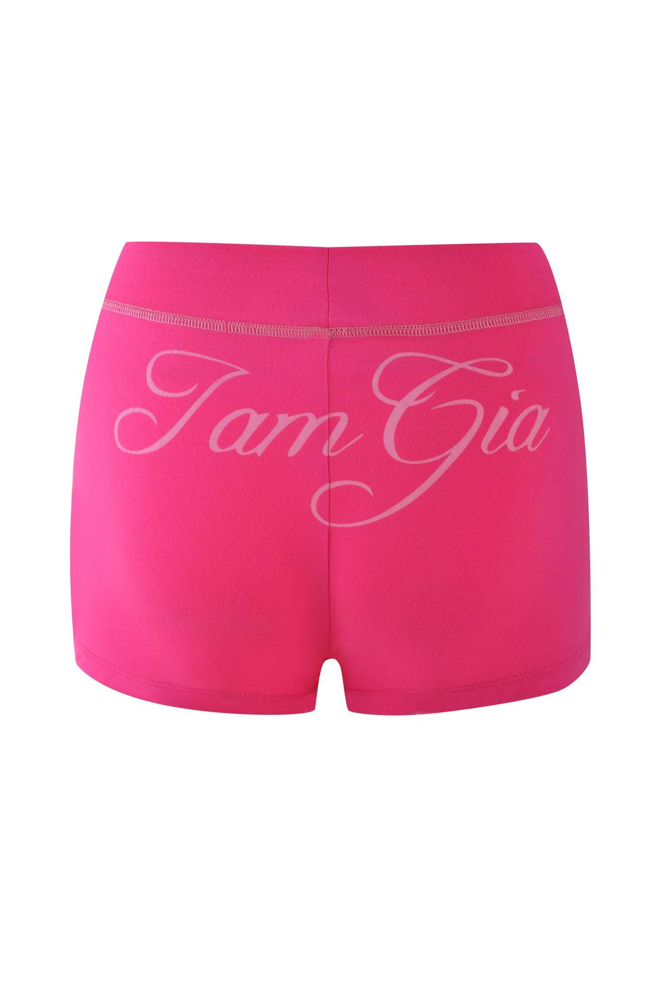 These hot pink BLARE SHORTS by I.AM.GIA are crafted from soft bamboo jersey, offering a bodycon fit and showcasing "Tam Gia" in elegant white script across the back.