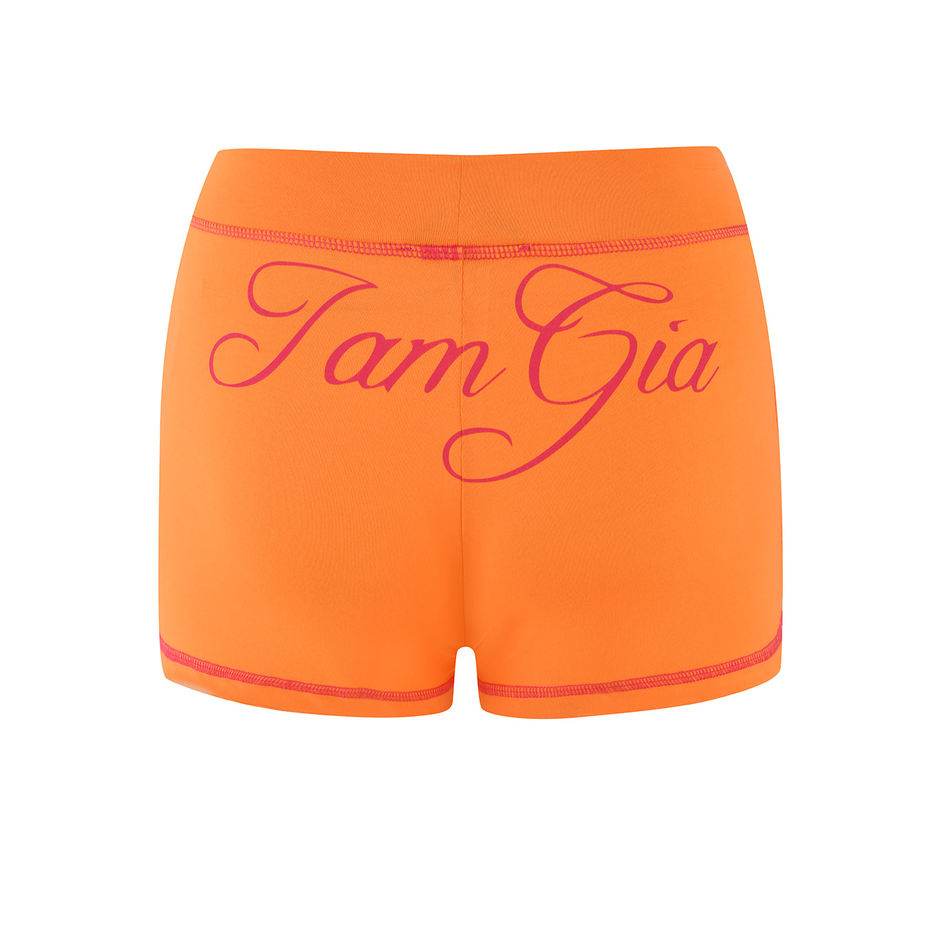 Orange Blare shorts by I.AM.GIA made from bamboo jersey with striking pink "I.AM.GIA" text on the back.