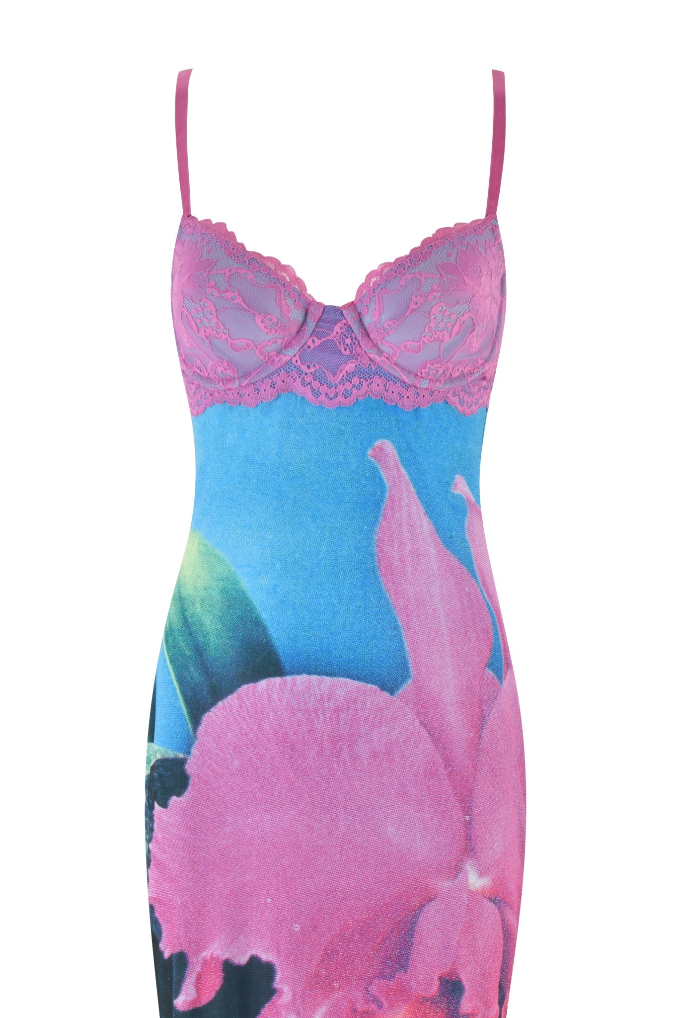 A form-fitting CALYPSO MAXI DRESS from I.AM.GIA, featuring thin straps and a vibrant Blue Orchid Print with large pink flowers and green leaves on a blue background. The dress is adorned with elegant lace detailing on the bodice.