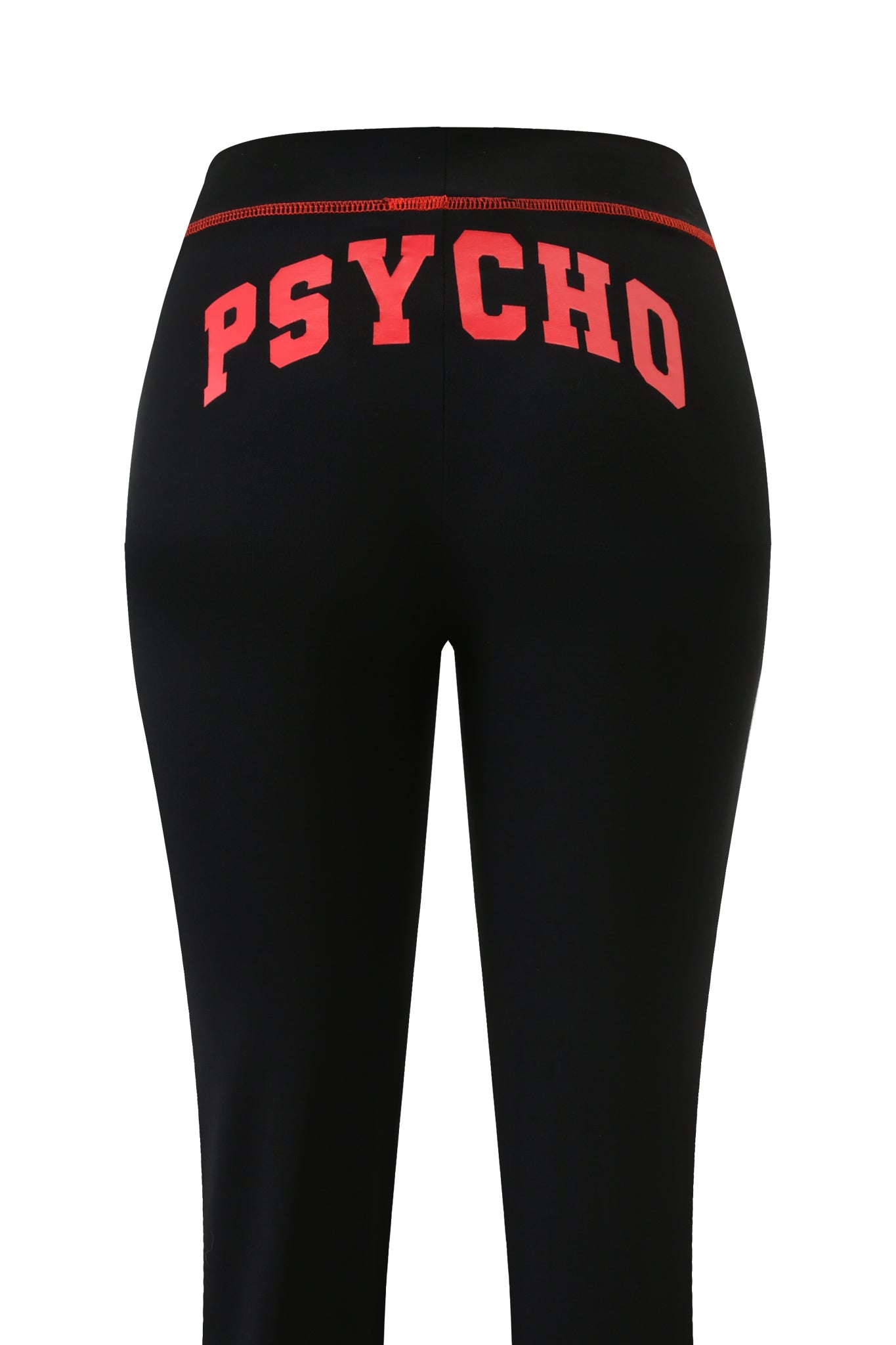 The BLARE TRACKPANT - BLACK PSYCHO by I.AM.GIA features "PSYCHO" in bold red caps on the back waistband, offering a statement look and comfortable low-rise fit.