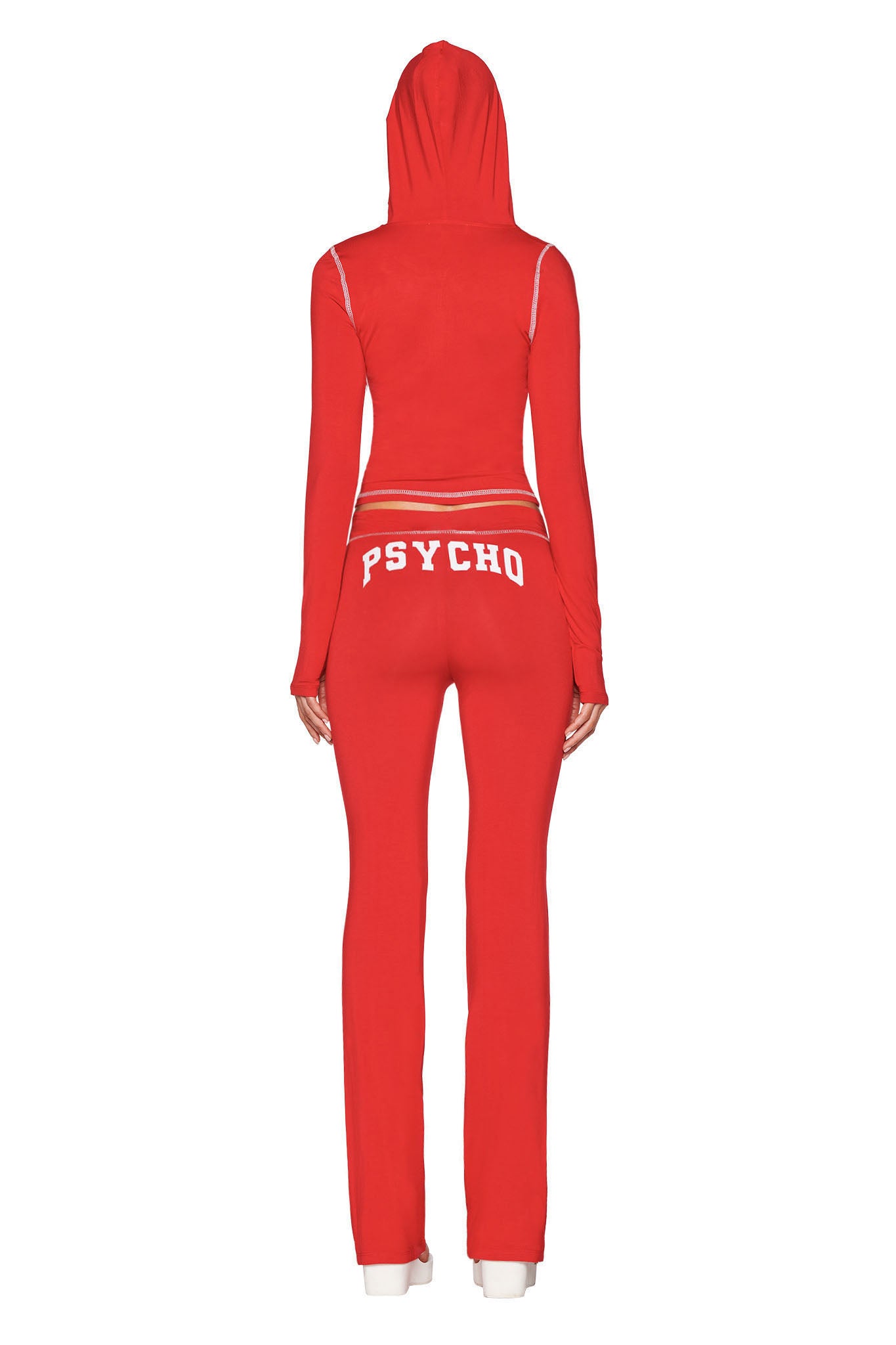 A person in a red I.AM.GIA BLARE TRACKPANT - RED : PSYCHO : SALSA set, viewed from behind with the hood up. "PSYCHO" is boldly printed in white across the back of their trackpants.