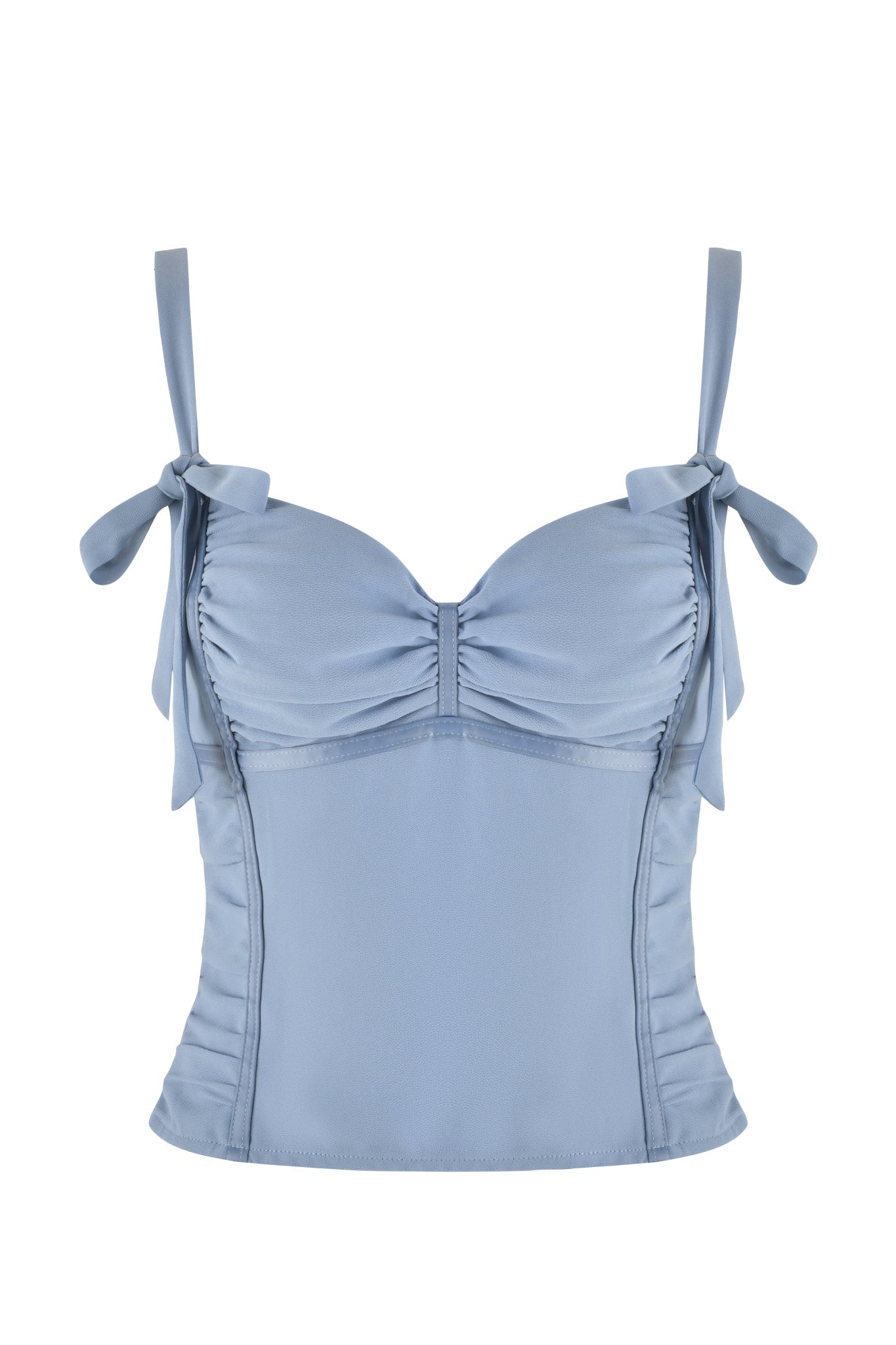 The QUEENIE TOP - BLUE by I.AM.GIA in steel blue showcases a sweetheart neckline with delicate straps tied into bows at the shoulders. It features subtle ruched paneling on the bodice, providing a structured, bodycon fit that elegantly enhances your silhouette.