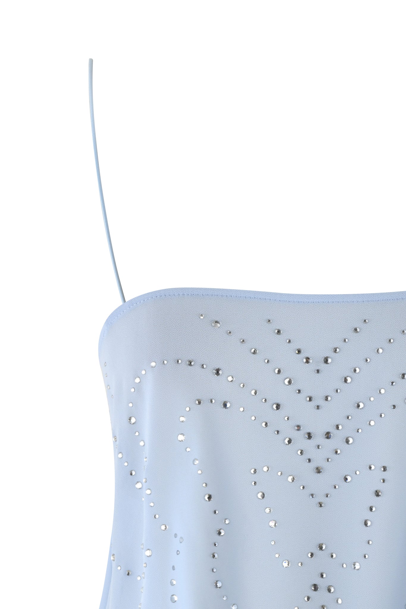 Close-up of the I.AM.GIA MINA TOP - BLUE, a baby blue tank top with a butterfly diamante design in silver studs. The semi-sheer georgette and delicate spaghetti straps stand out against a white background.