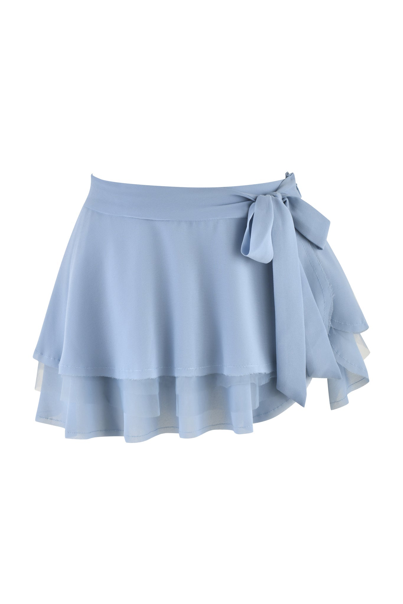 Introducing the QUEENIE MINI SKIRT by I.AM.GIA, available in a serene steel blue hue. This chic mini skirt showcases a flowing, ruffled design crafted from georgette fabric, complete with a charming ribbon tie on the side for an elegantly soft and airy look.