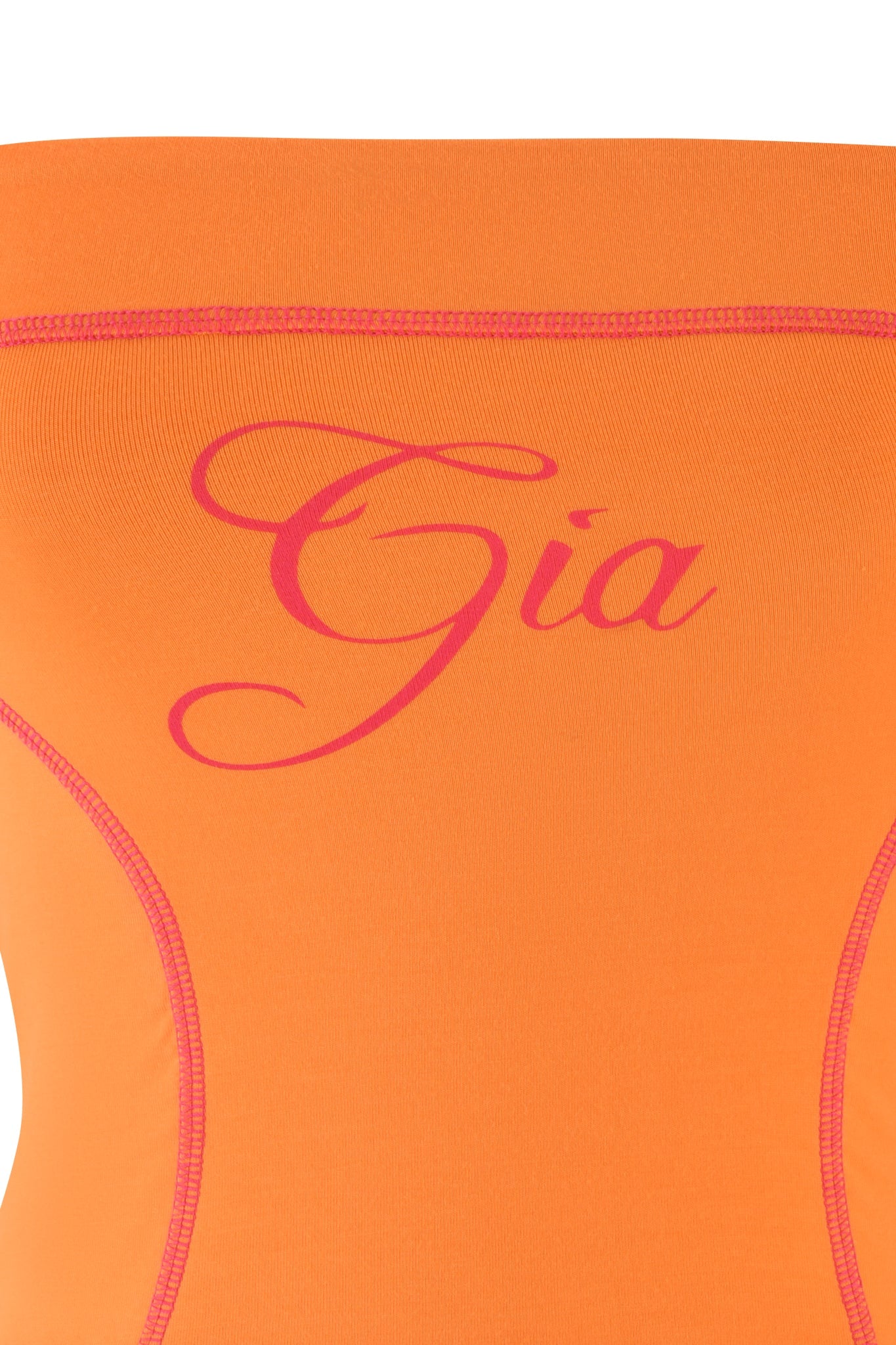 Close-up of an orange BLARE BOOB TUBE from I.AM.GIA, featuring "Gia" in elegant pink script across the chest, with visible stitching highlighting gentle curves and sporty princess seams for a fitted design.