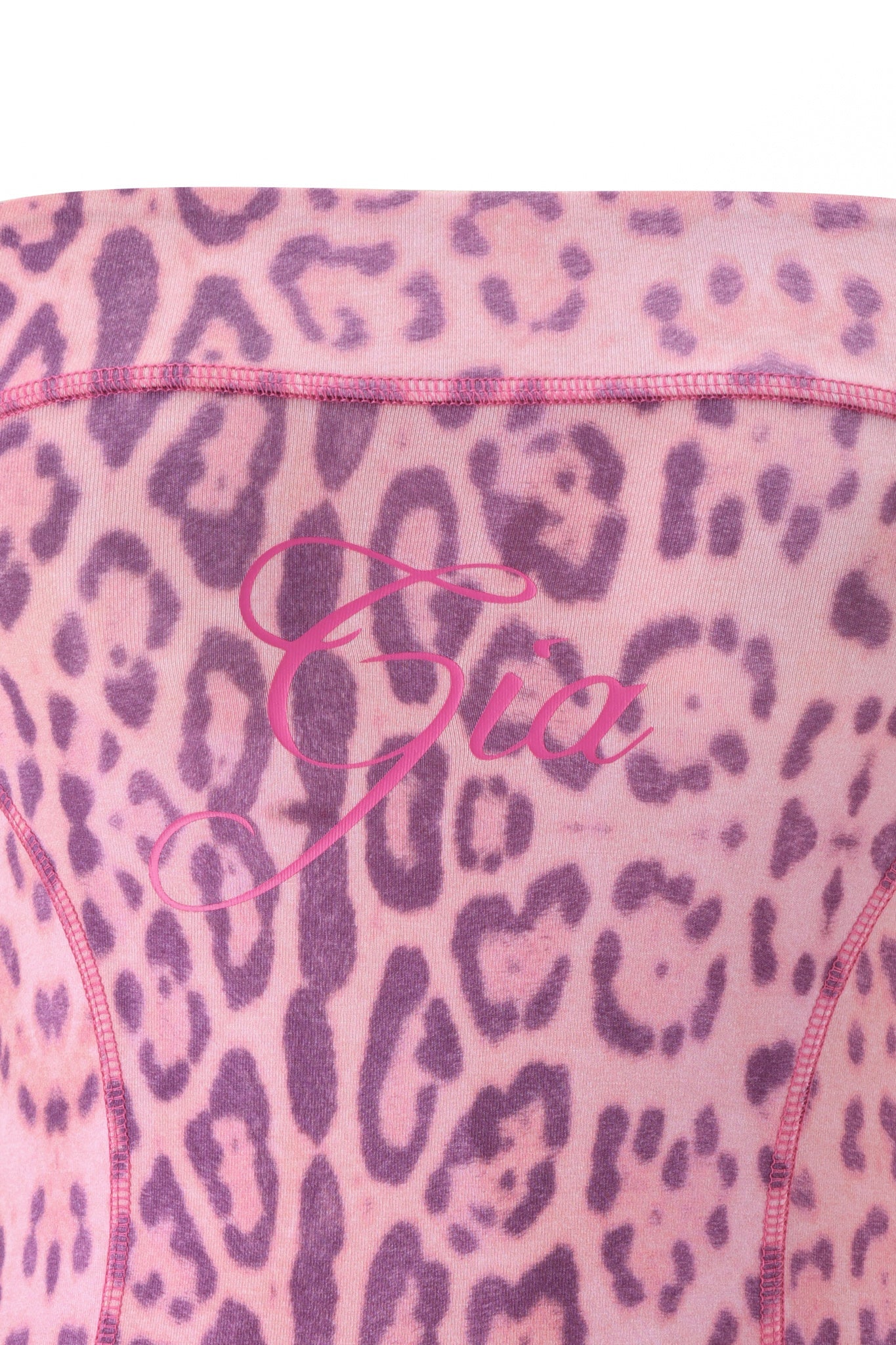 The BLARE BOOB TUBE - PINK PANTHERA by I.AM.GIA features a pink and purple Panthera print with "Gia" in flowing pink script across the center, reminiscent of an iconic crop top.