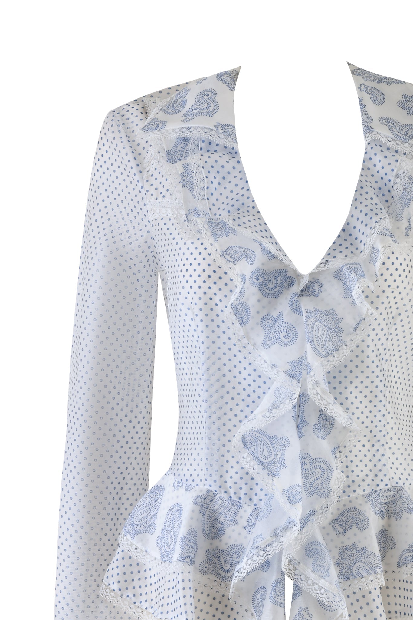 A close-up of the I.AM.GIA "OPAL TOP - WHITE: MIXED PRINTS" features blue paisley ruffled panels on a polka dot blouse with a deep V-neckline and elasticated cinch waist. Crafted from semi-sheer, lightweight fabric, the top is set against a white backdrop.