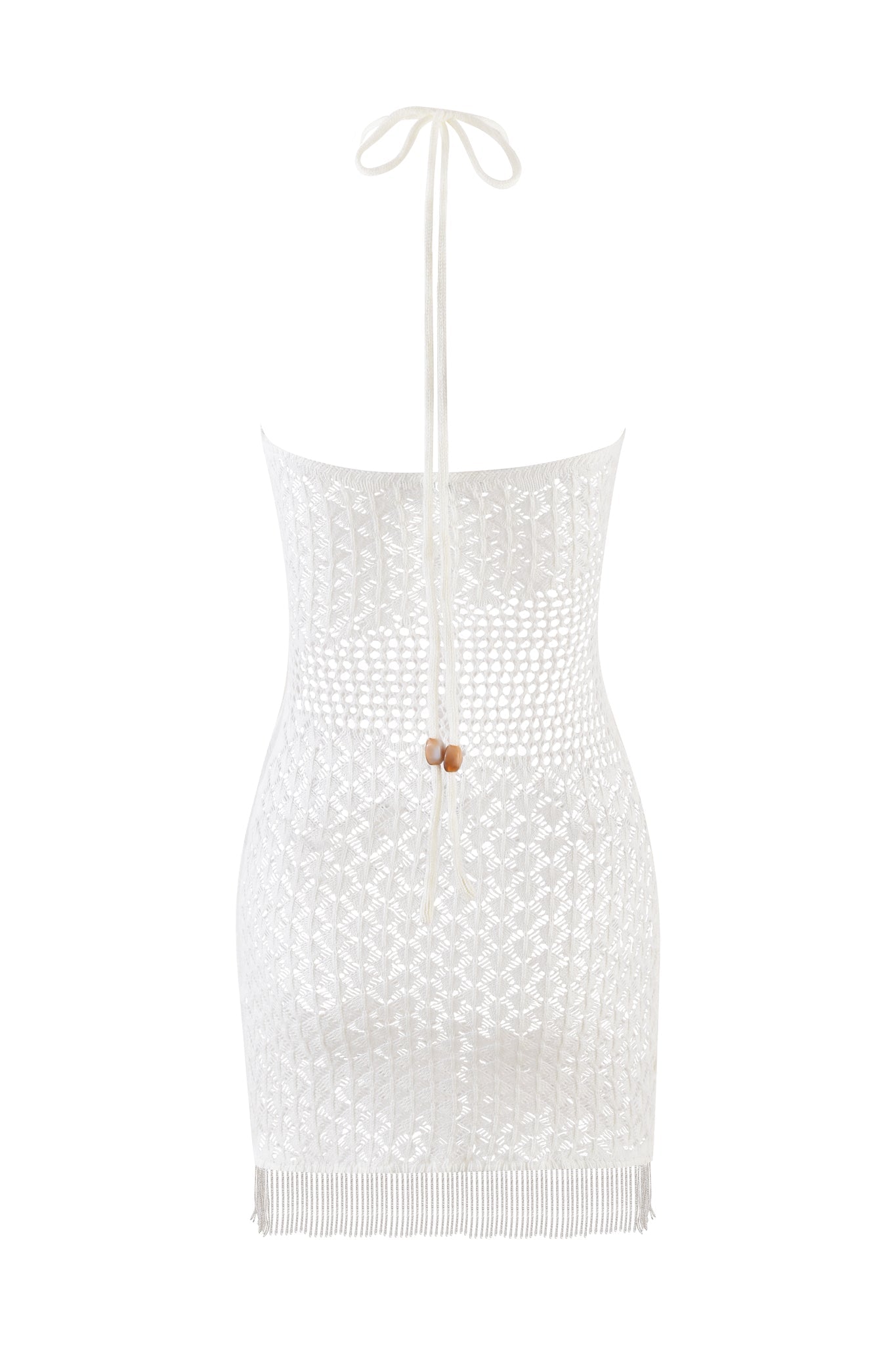 The I.AM.GIA CORALIE MINI DRESS in beige and cream features a white crochet halter design, intricate patterns, and a beaded fringe hem. It ties at the neck with tortoise bead fastenings and is displayed against a plain white background.