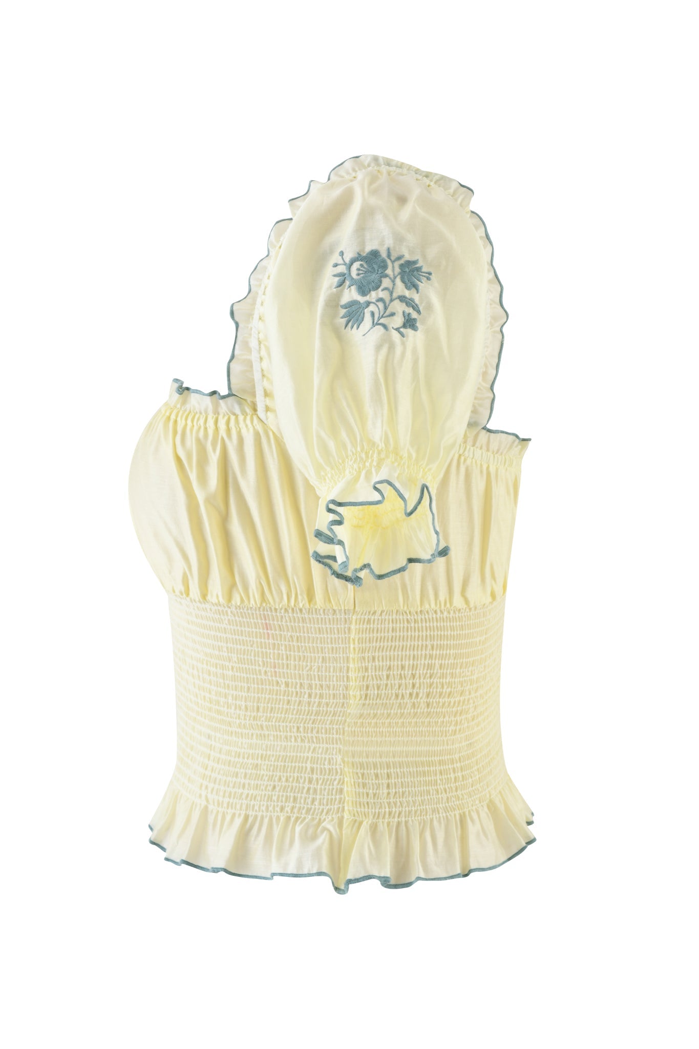 The CLOVER TOP - YELLOW by I.AM.GIA is a lightweight cotton smocked top with ruffled edges, featuring a bonnet-like hood with intricate blue floral embroidery and a playful blue bunny outline on the back.