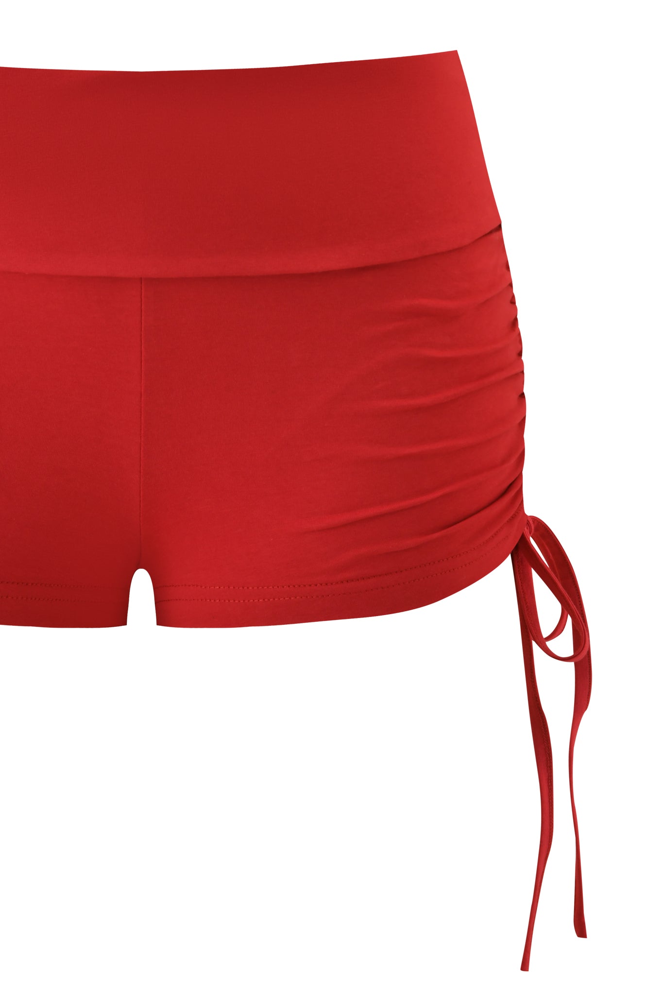 The I.AM.GIA MIA SHORT - RICH RED women’s swim shorts feature side ruching, a fold-over waistband, and a drawstring tie on the right hip, shown against a white background.