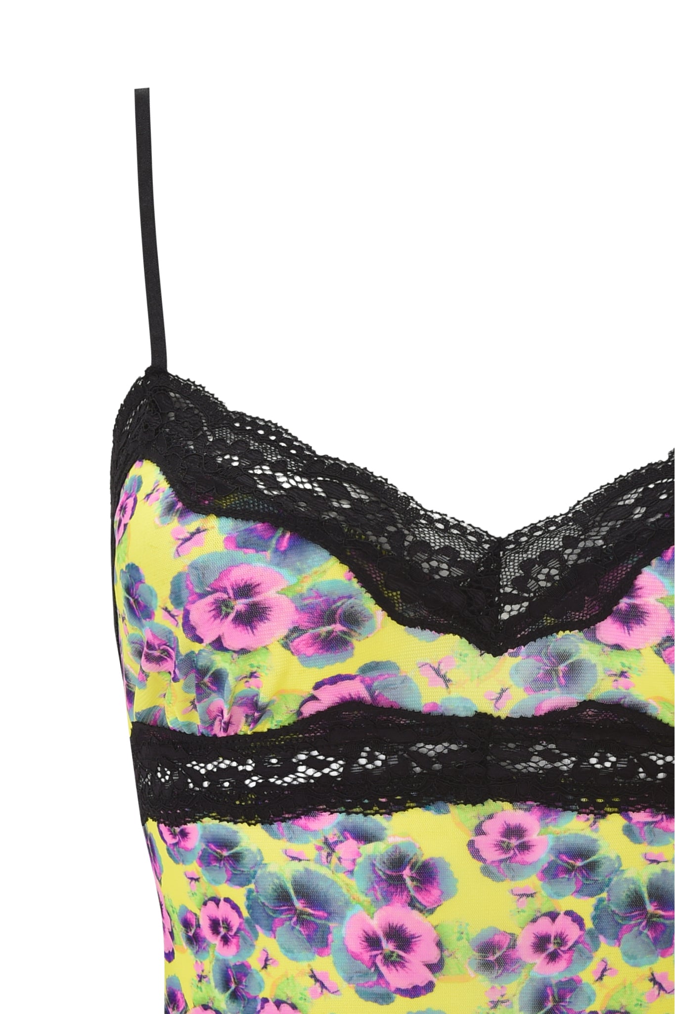Close-up of the I.AM.GIA GRACIE LACE CAMI - SASSY PANSY featuring a neon yellow background, purple and blue floral print, black lace trim at the top edge, and thin black straps.