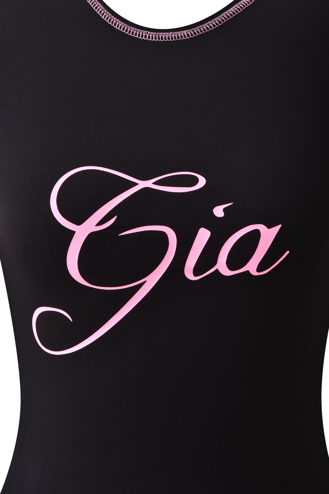 Close-up of the BLARE LONG SLEEVE TOP - BLACK by I.AM.GIA, featuring “Gia” in large pink cursive letters across the chest.