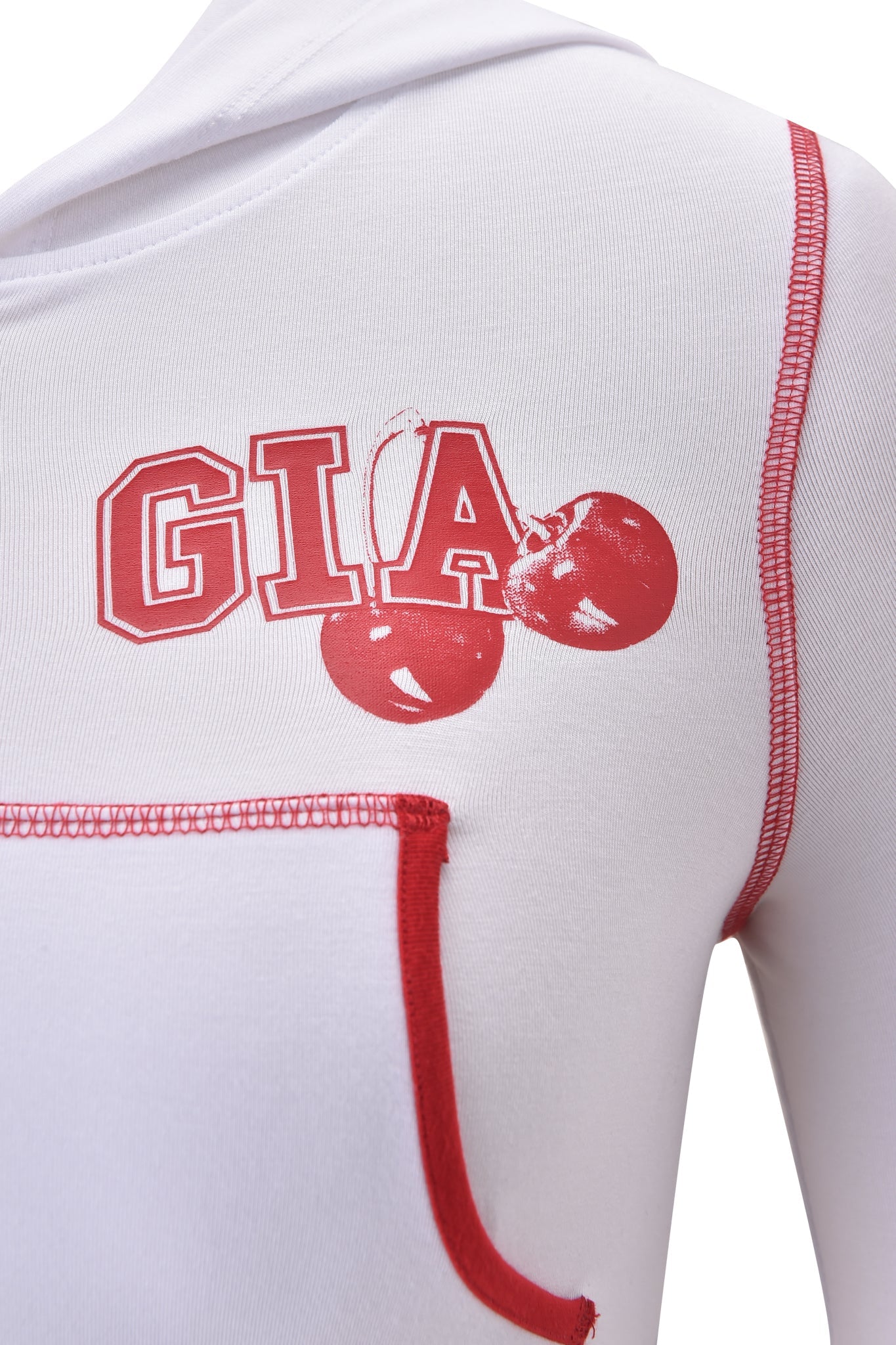 Close-up of the BLARE CROPPED HOODIE in white by I.AM.GIA, featuring red trim, a cherry graphic, "GIA" lettering on the chest, and a front pocket with red edging—a signature I.AM.GIA style.
