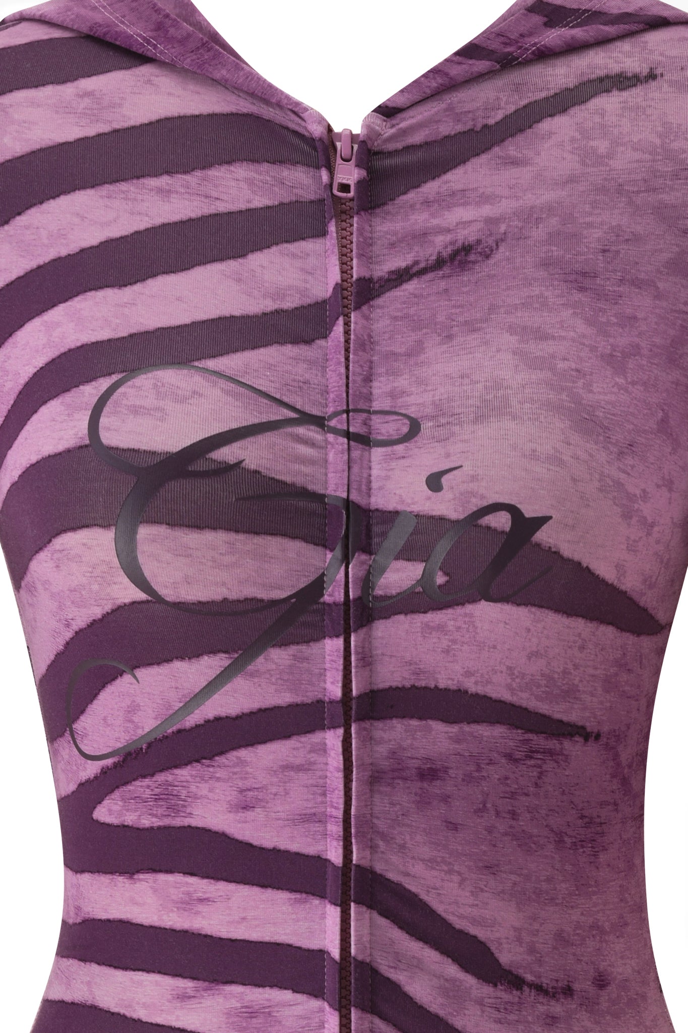 Close-up of the BLARE SHORT SLEEVE ROMPER - PLUM WILD SIDE by I.AM.GIA, a purple and lavender zebra print mini romper with a center zipper and bold script across the chest, featuring a signature bodycon fit.