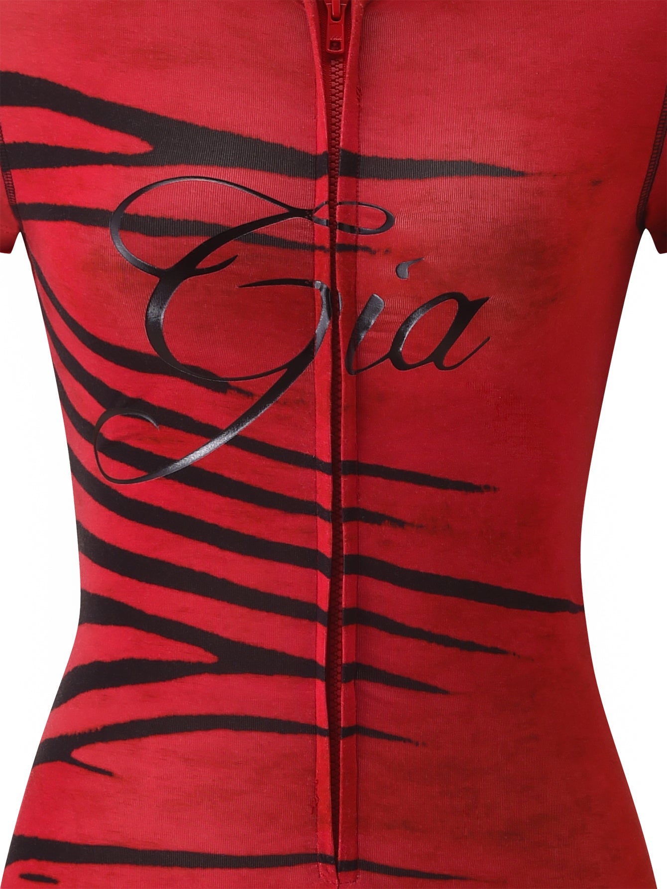 The BLARE SHORT SLEEVE ROMPER - RED WILD SIDE by I.AM.GIA features a vibrant red, zip-up design adorned with bold black zebra-inspired stripes and “Gia” elegantly written in cursive across the chest. The image showcases the upper torso of the romper set against a white background.