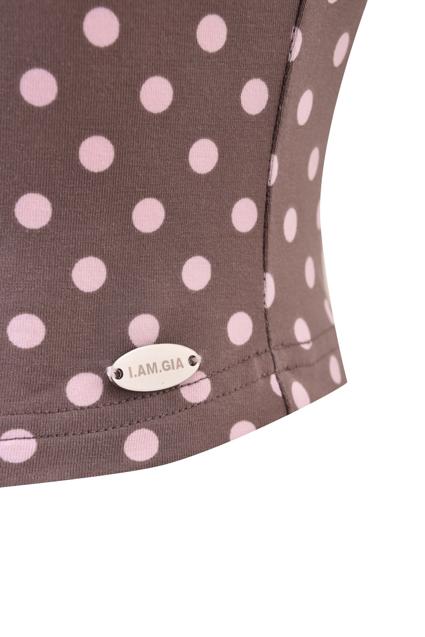 Close-up of the I.AM.GIA BLARE HALTER STRAP TOP in Pink Chocolate, showcasing a brown halter strap design with light pink polka dots and a small metallic I.AM.GIA tag near the seam.