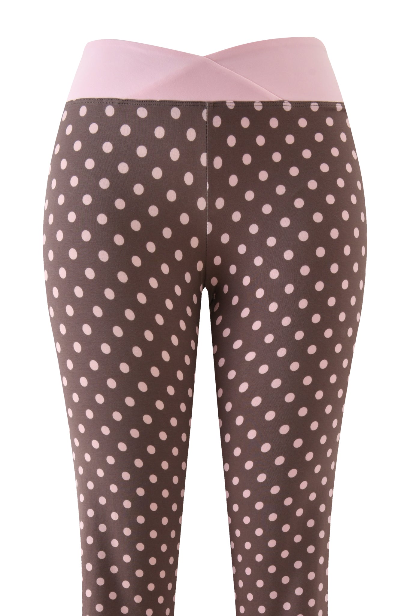 The I.AM.GIA BLARE CROSSOVER PANT - PINK CHOCOLATE features a mid rise, light pink polka dot print, and a wide pale pink crossover waistband, shown from the front on a white background.