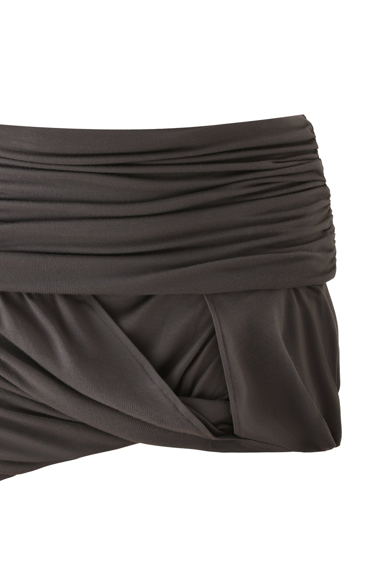Close-up of the I.AM.GIA KOVU MINI SKIRT in charcoal grey, featuring a ruched, high-waisted design with layered, draped fabric details, reminiscent of a jersey skirt, shown against a white background.