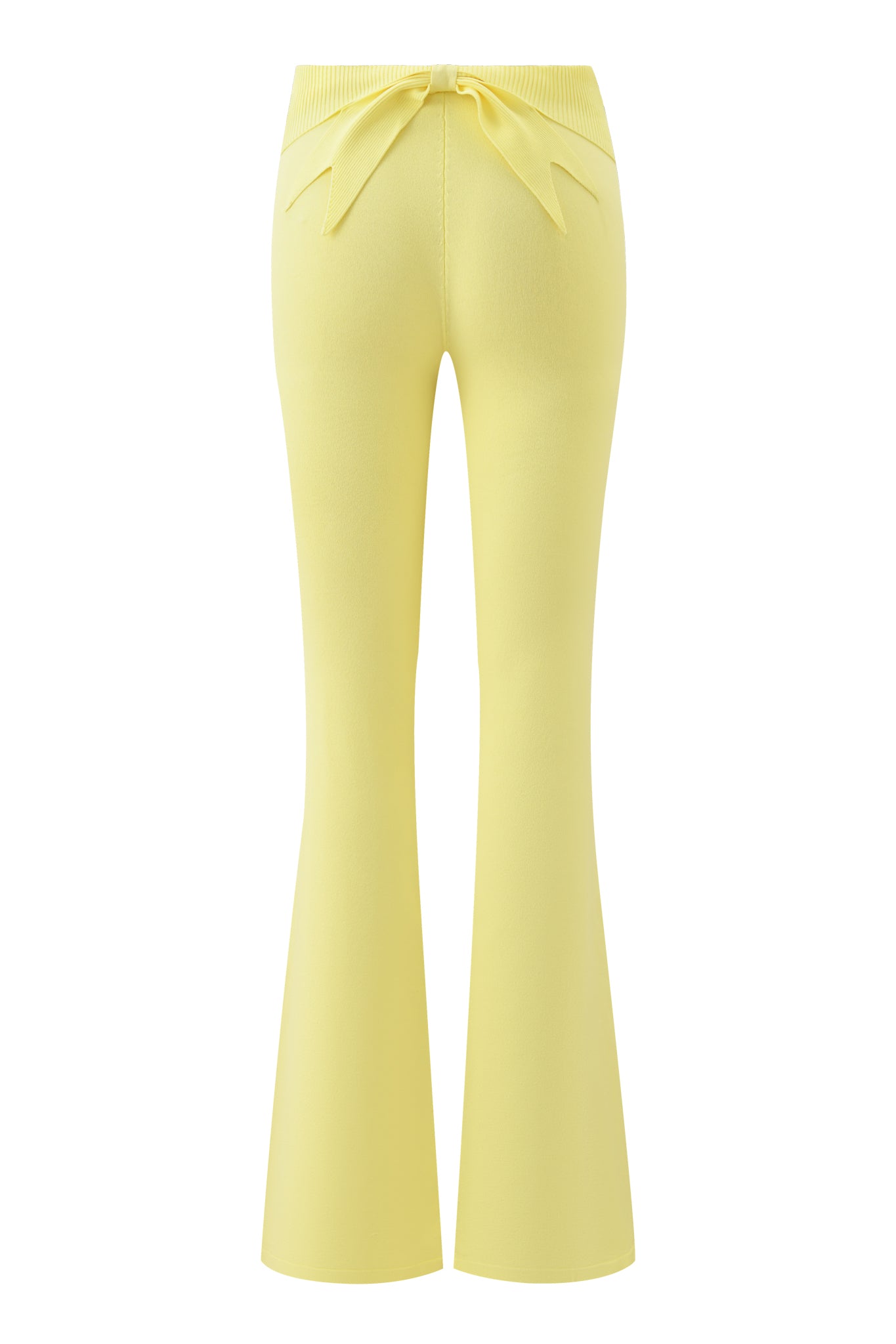 Back view of the MORGANA 2.0 PANT in Baby Yellow by I.AM.GIA, featuring a high waist, flared legs, and a decorative bow at the seamless waistband in smooth, stretchy knit for comfort.