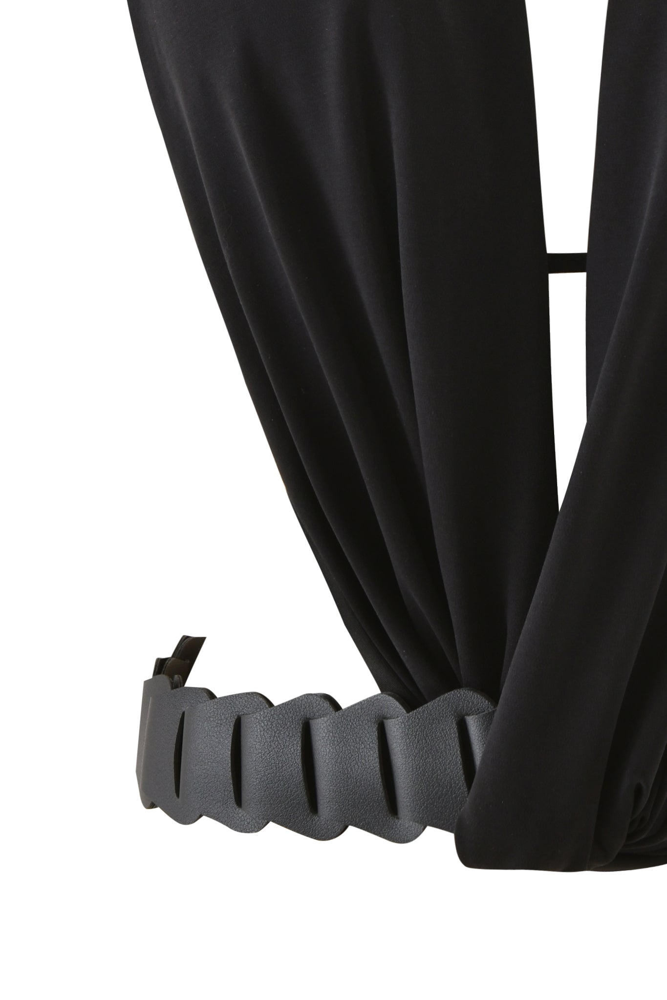 Close-up of the SALDANA TOP in black by I.AM.GIA, a plunging halter style with draped fabric, paired with a wide textured faux leather belt featuring a wavy scalloped edge and rectangular buckle.