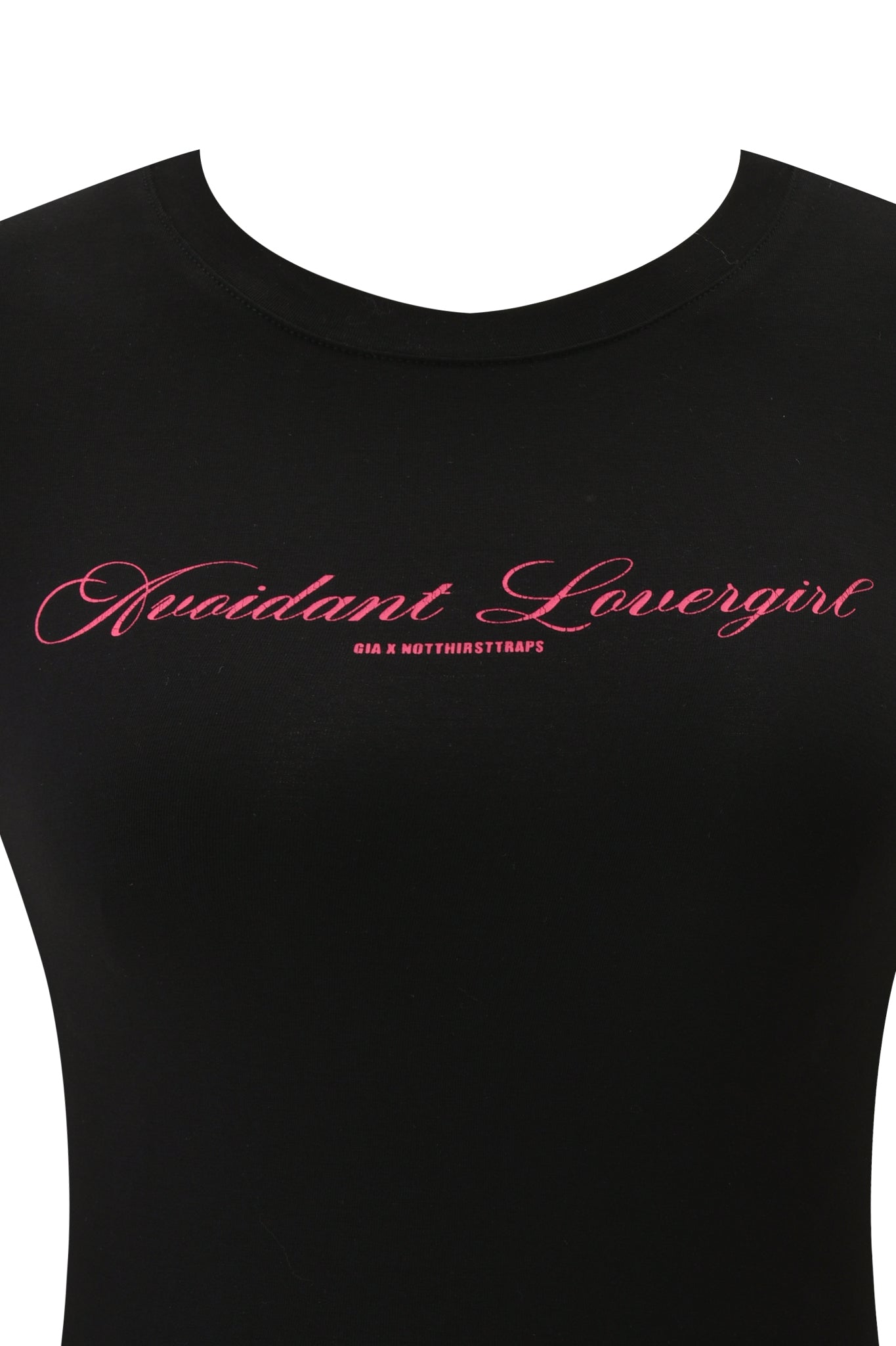 The POLINA AVOIDANT 2.0 TEE by I.AM.GIA is a black fitted baby tee in soft cotton jersey, featuring "Nuidant Lovergirl" in pink cursive and "GIA X NOTHIRSTTRAPS" below for a cute, modern look.
